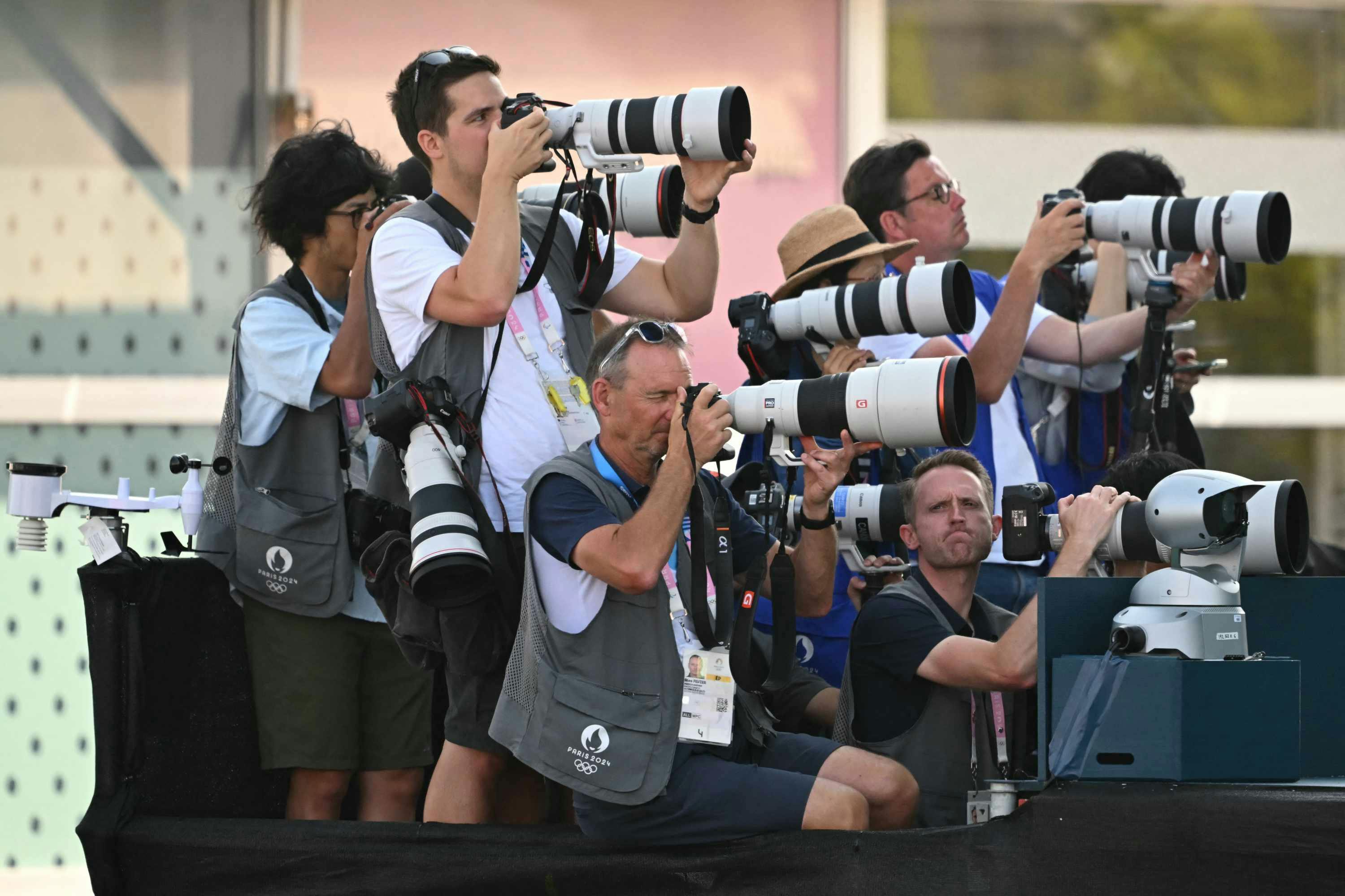 Olympics 2024 photographers wear brown vests