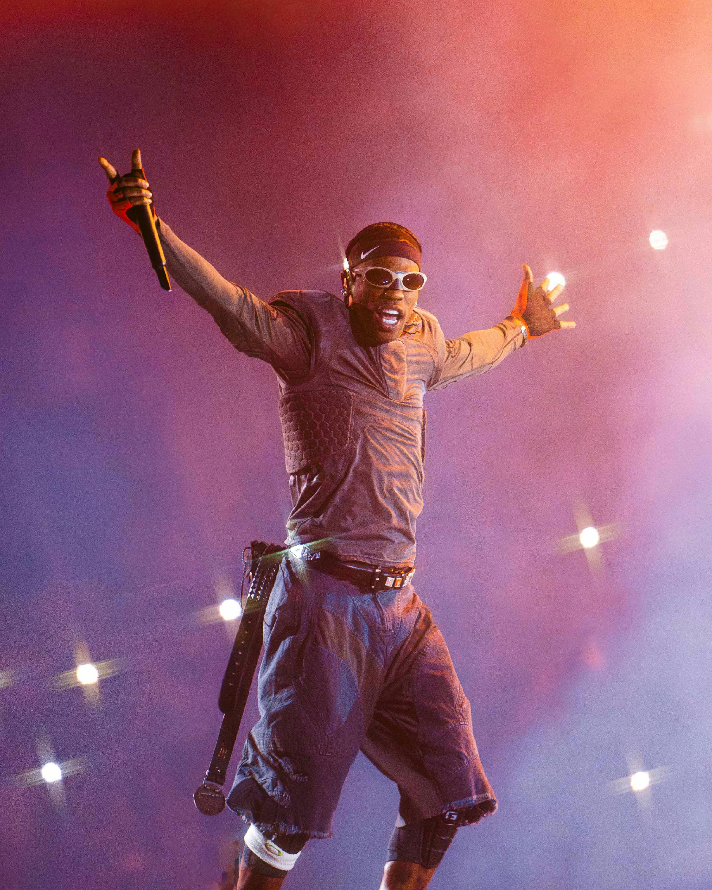 Travis Scott wears oakley sunglasses while performing live during circus maximus tour