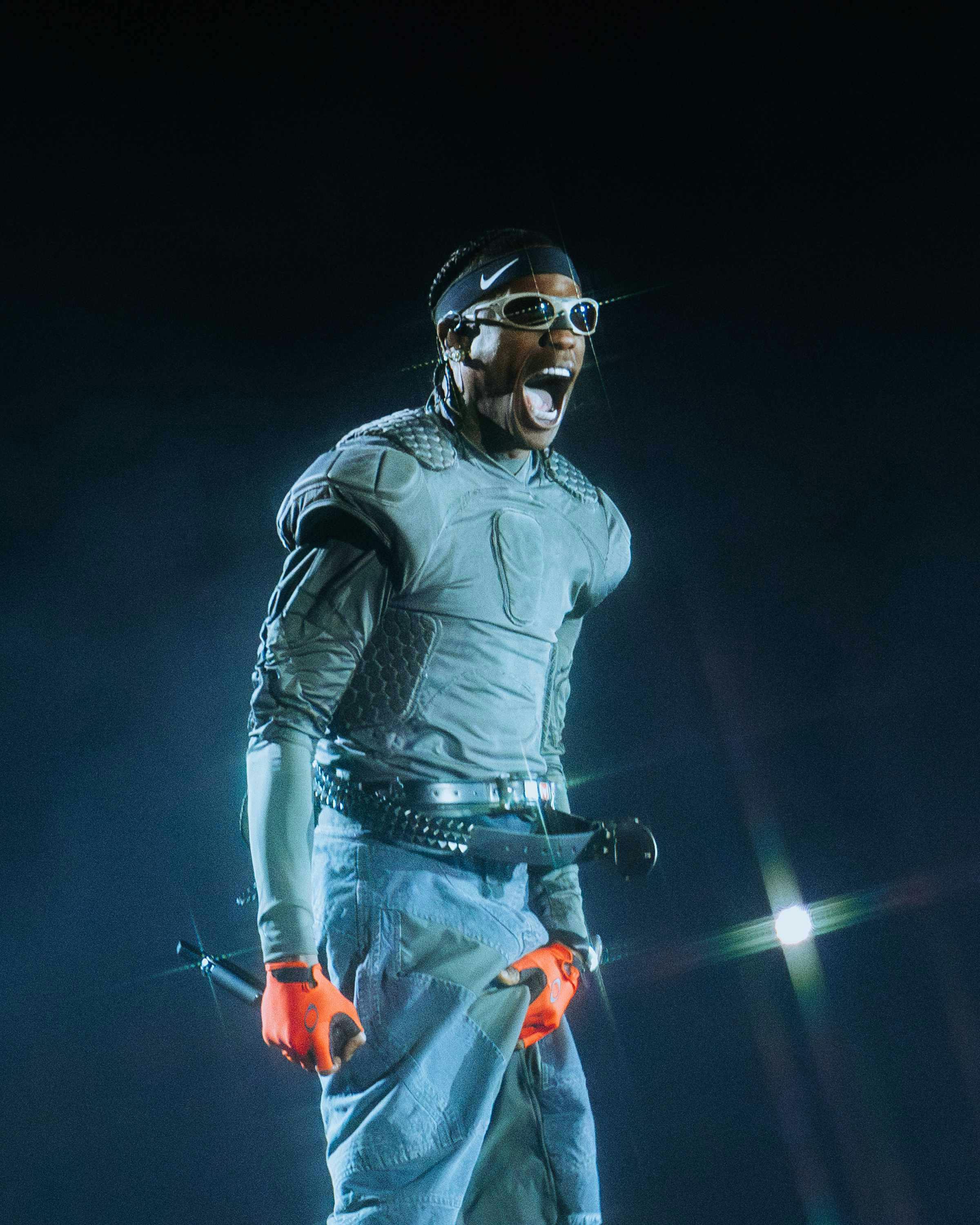 Travis Scott wears oakley sunglasses while performing live during circus maximus tour