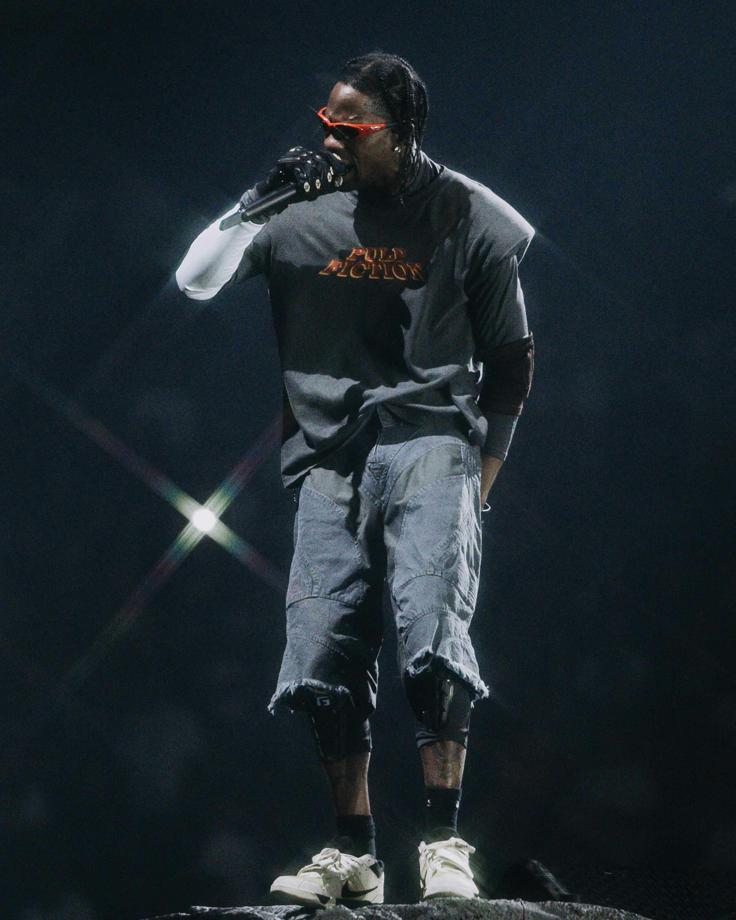 Travis Scott wears oakley sunglasses while performing live during circus maximus tour