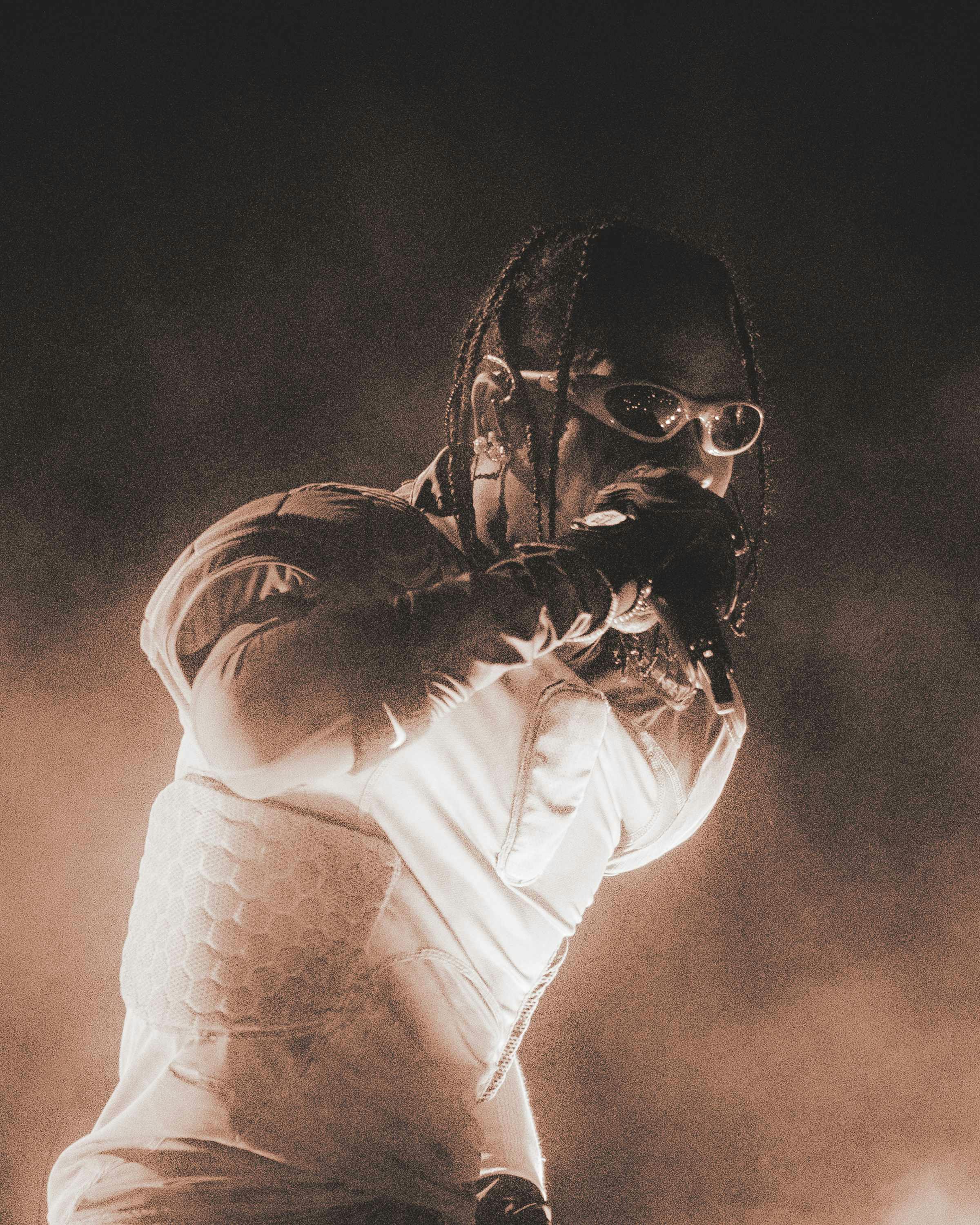 Travis Scott wears oakley sunglasses while performing live during circus maximus tour