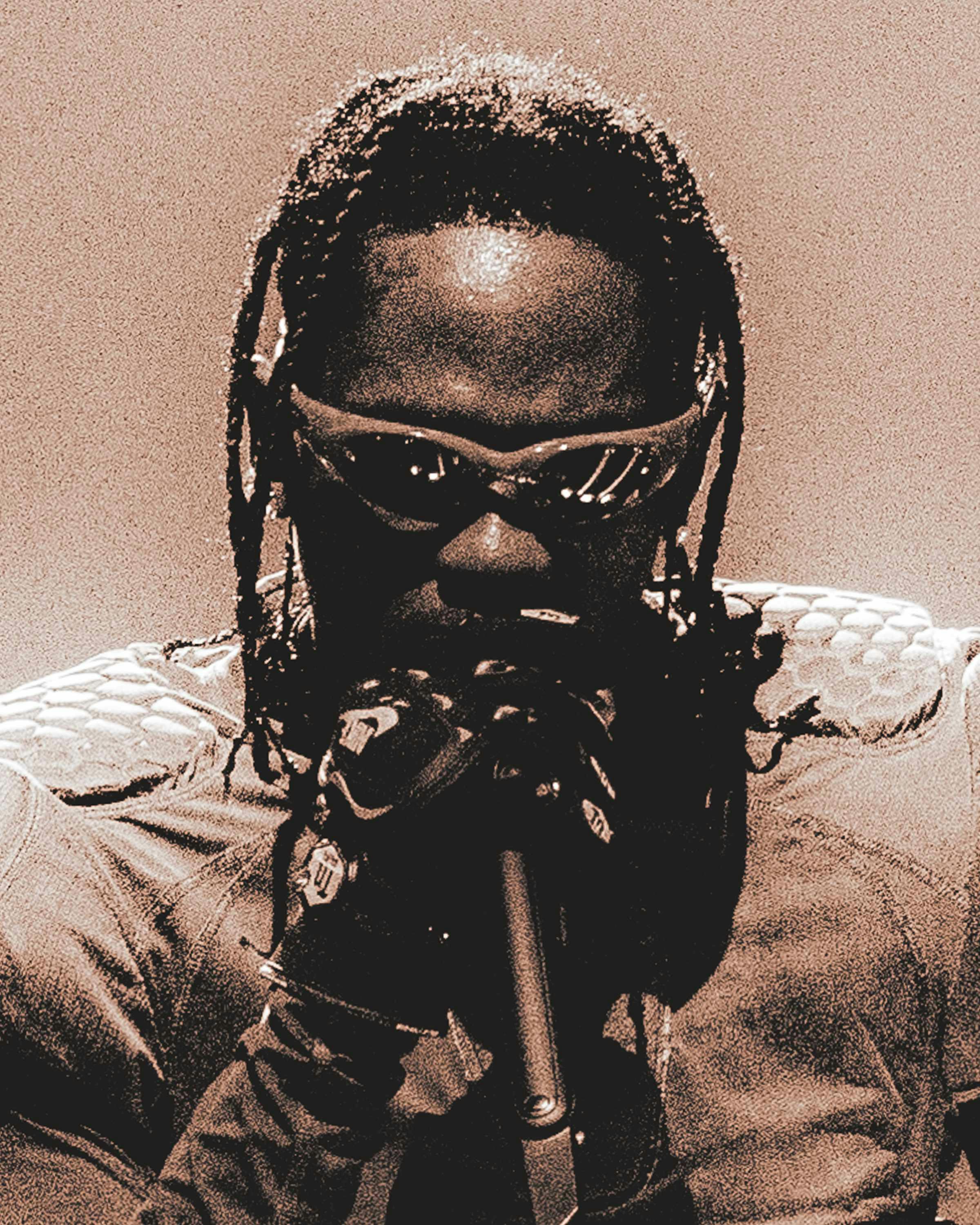 Travis Scott wears oakley sunglasses while performing live during circus maximus tour