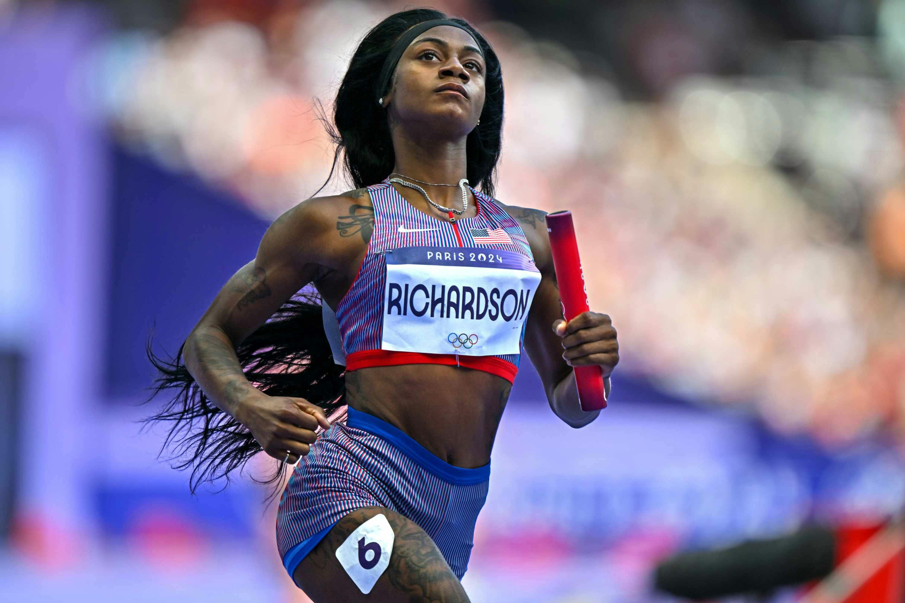 Sha'Carri Richardson runs in Nike sportswear at the 2024 Olympics