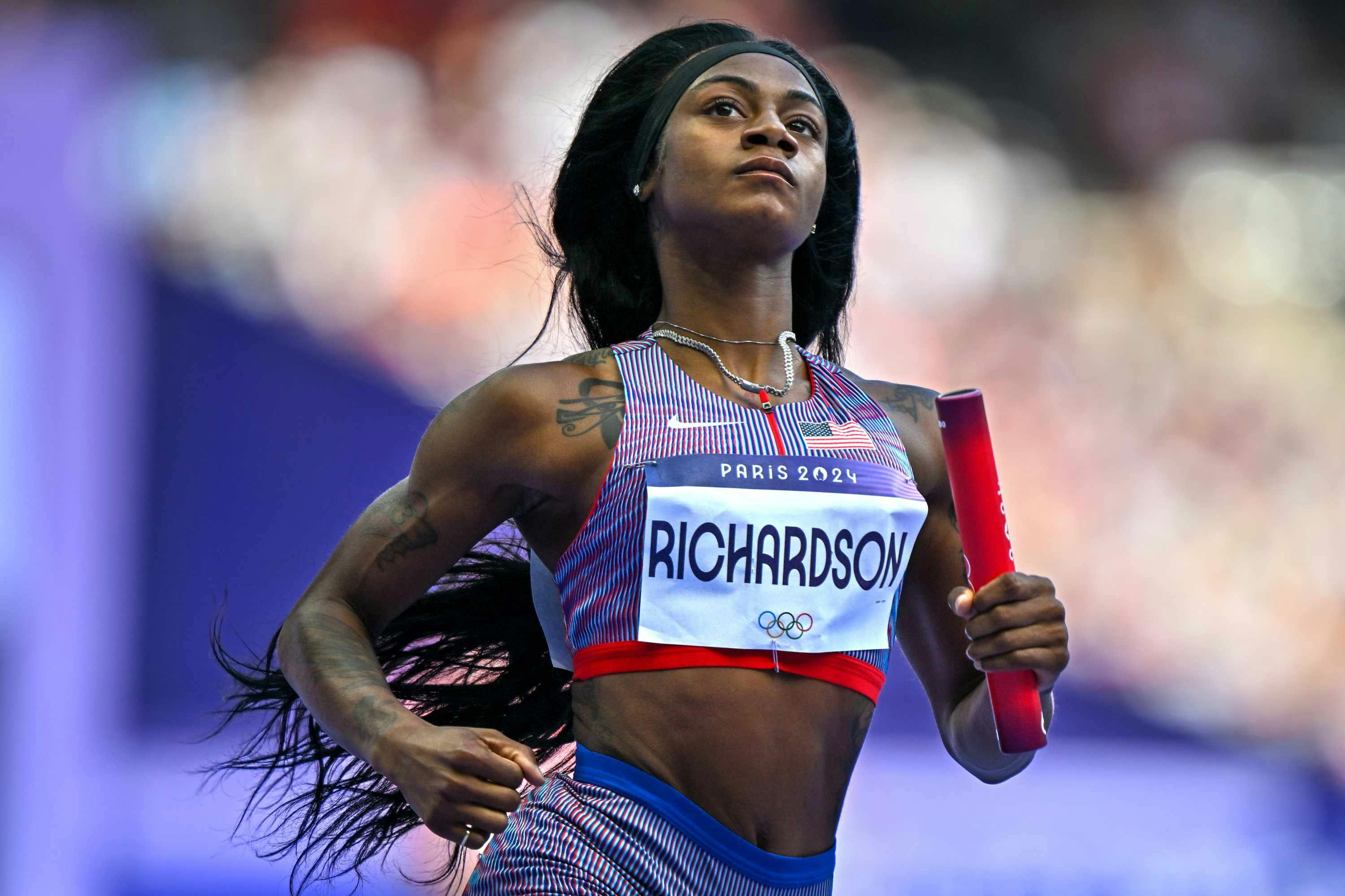 Sha'Carri Richardson runs in Nike sportswear at the 2024 Olympics