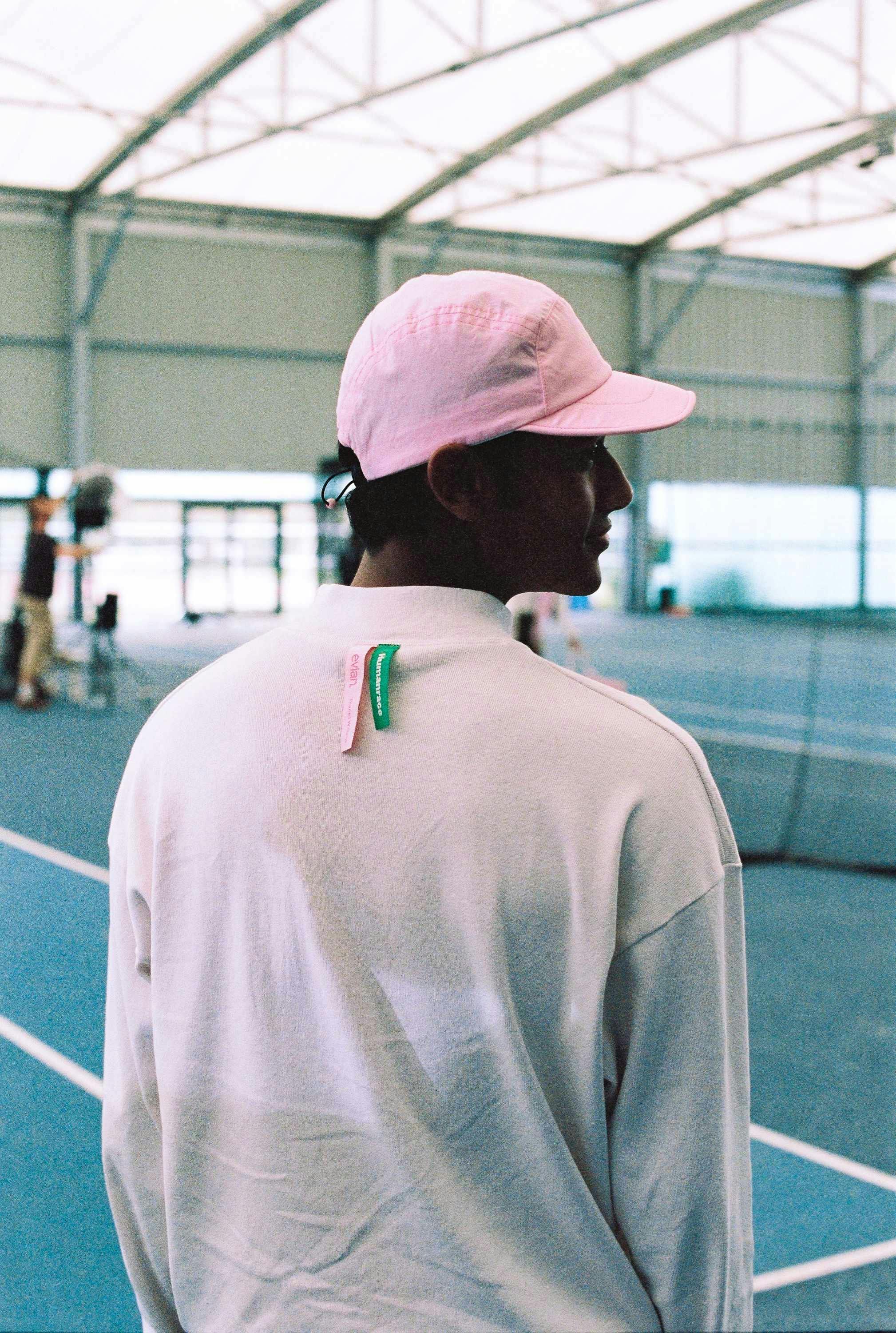 pharrell's evian x humanrace clothing collection collab, including sweaters, shirts and bags