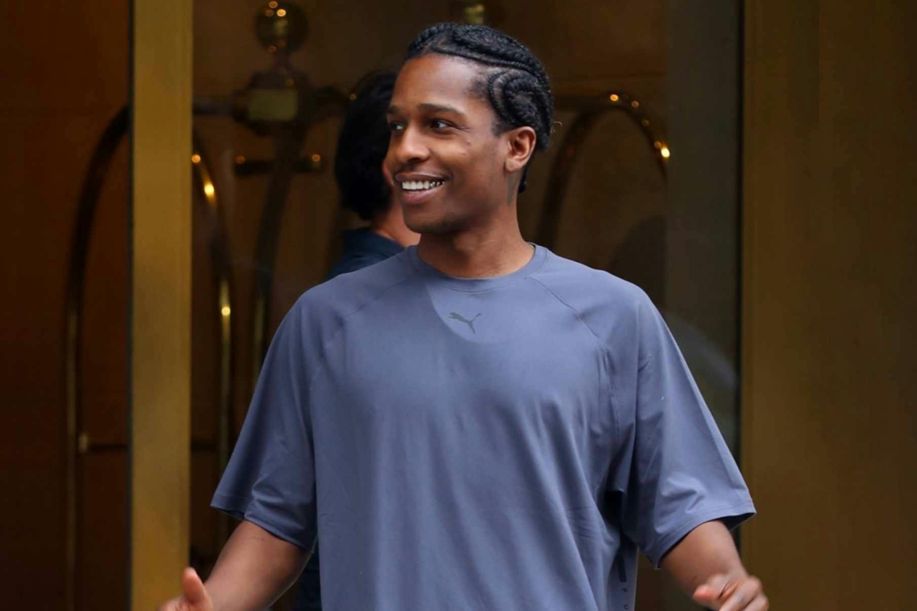 A$AP Rocky wears PUMA T-shirt, track pants, sneakers