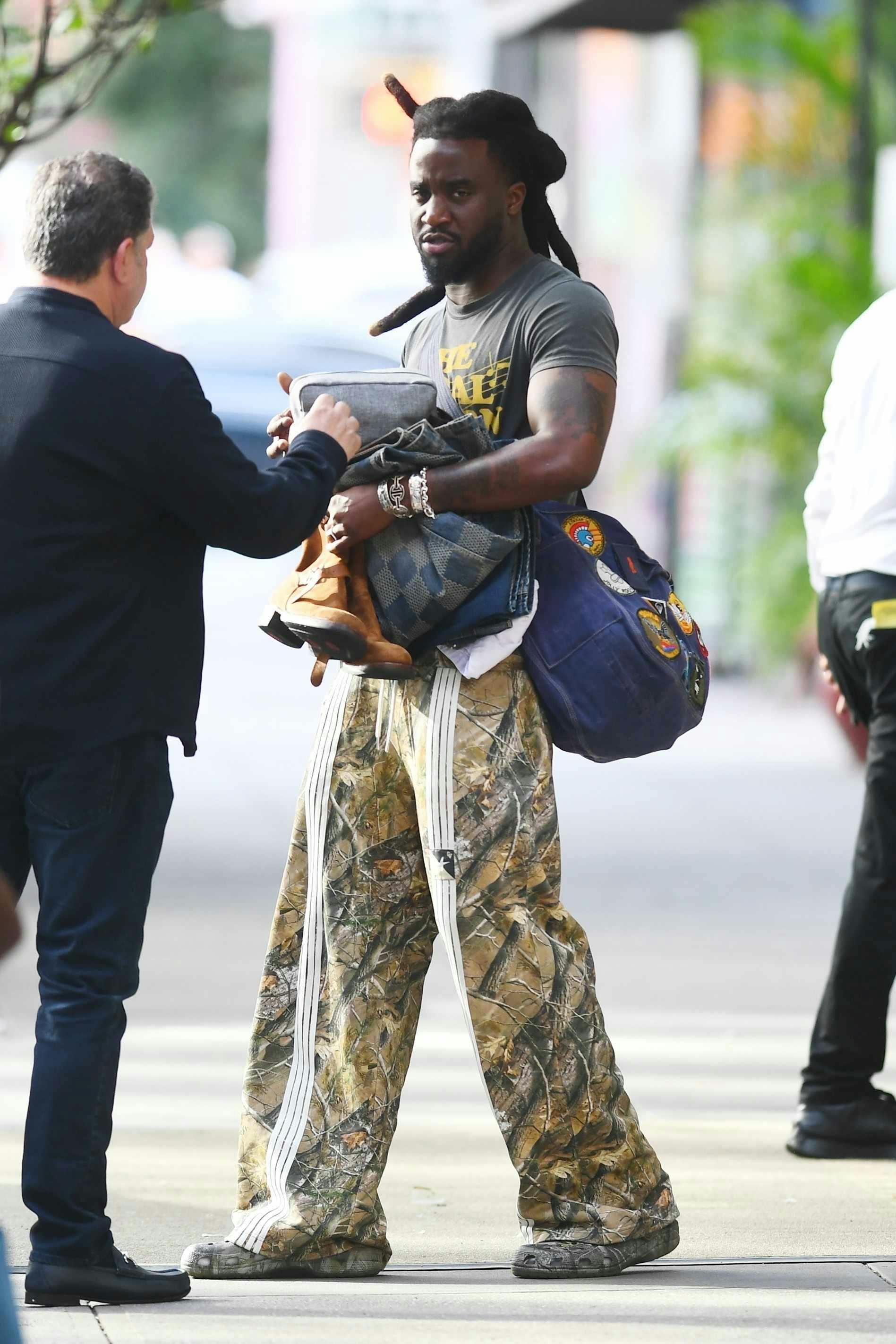 shaboozey wears realtree pants & camouflage crocs clogs in new york