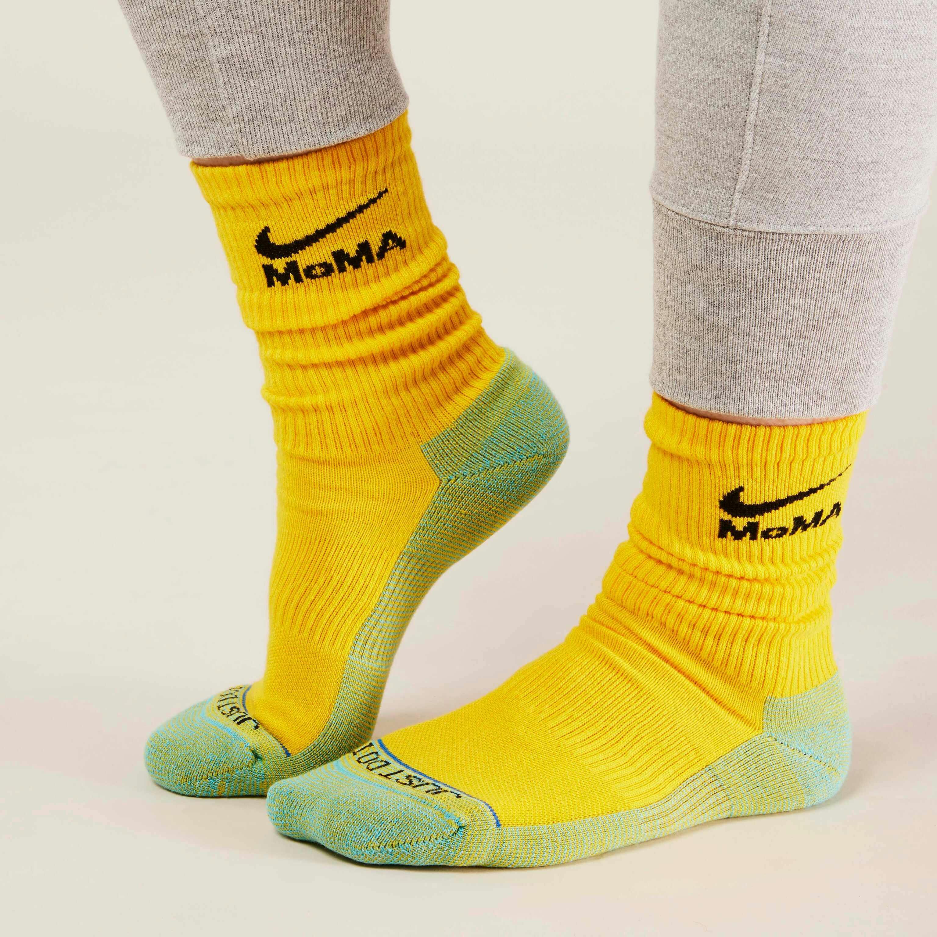 MoMA x Nike sock collaboration in white yellow green blue pink