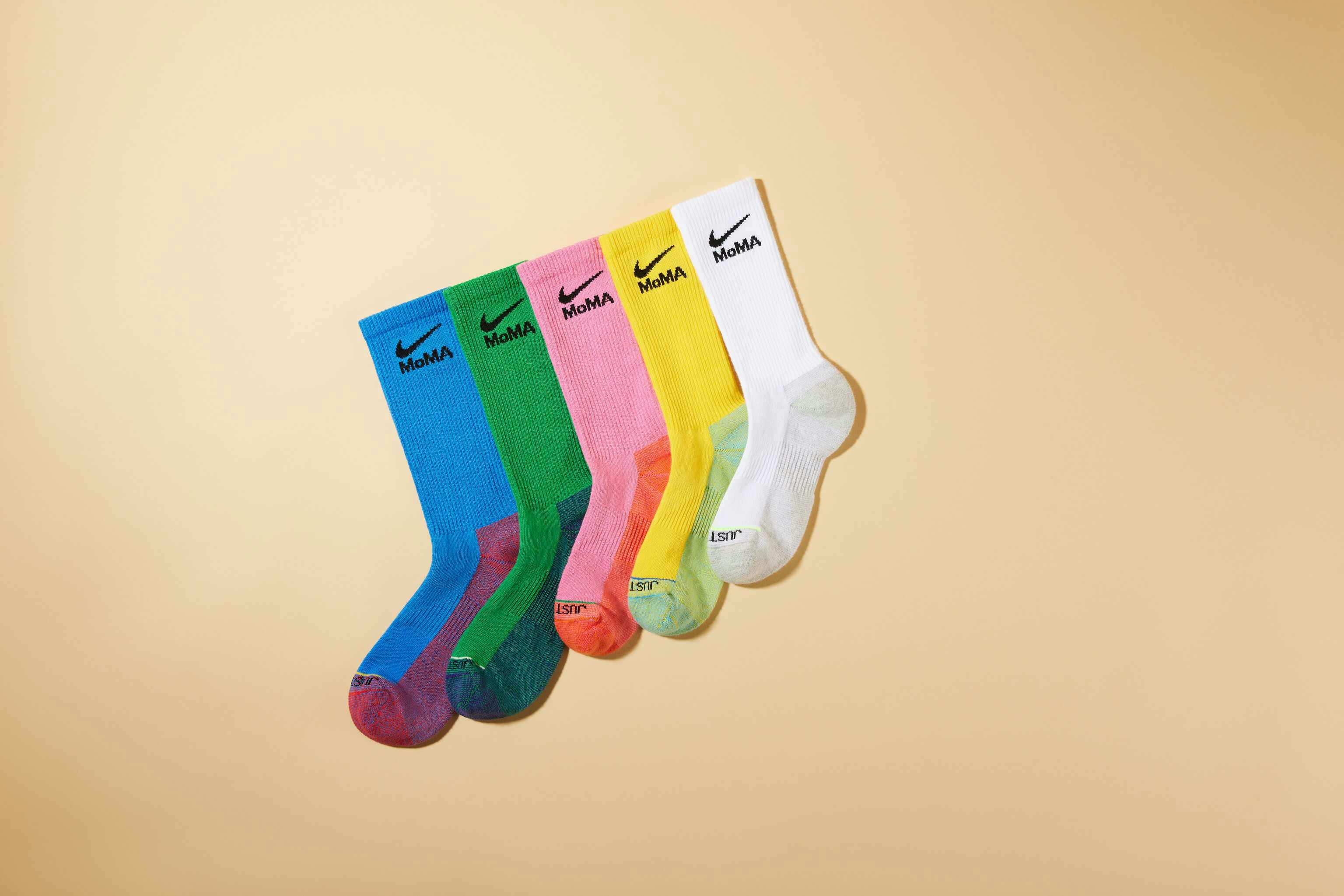 MoMA x Nike sock collaboration in white yellow green blue pink