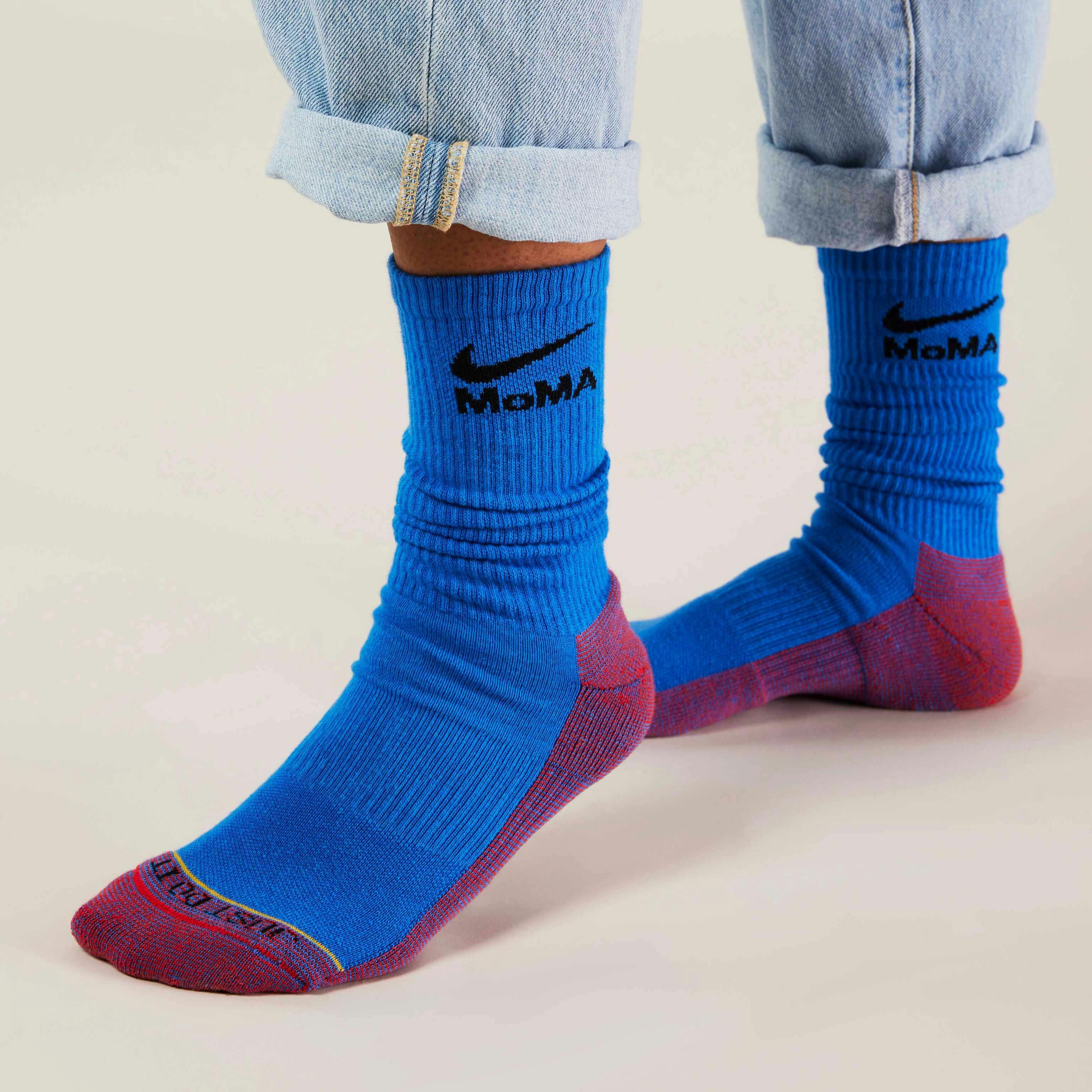 MoMA x Nike sock collaboration in white yellow green blue pink