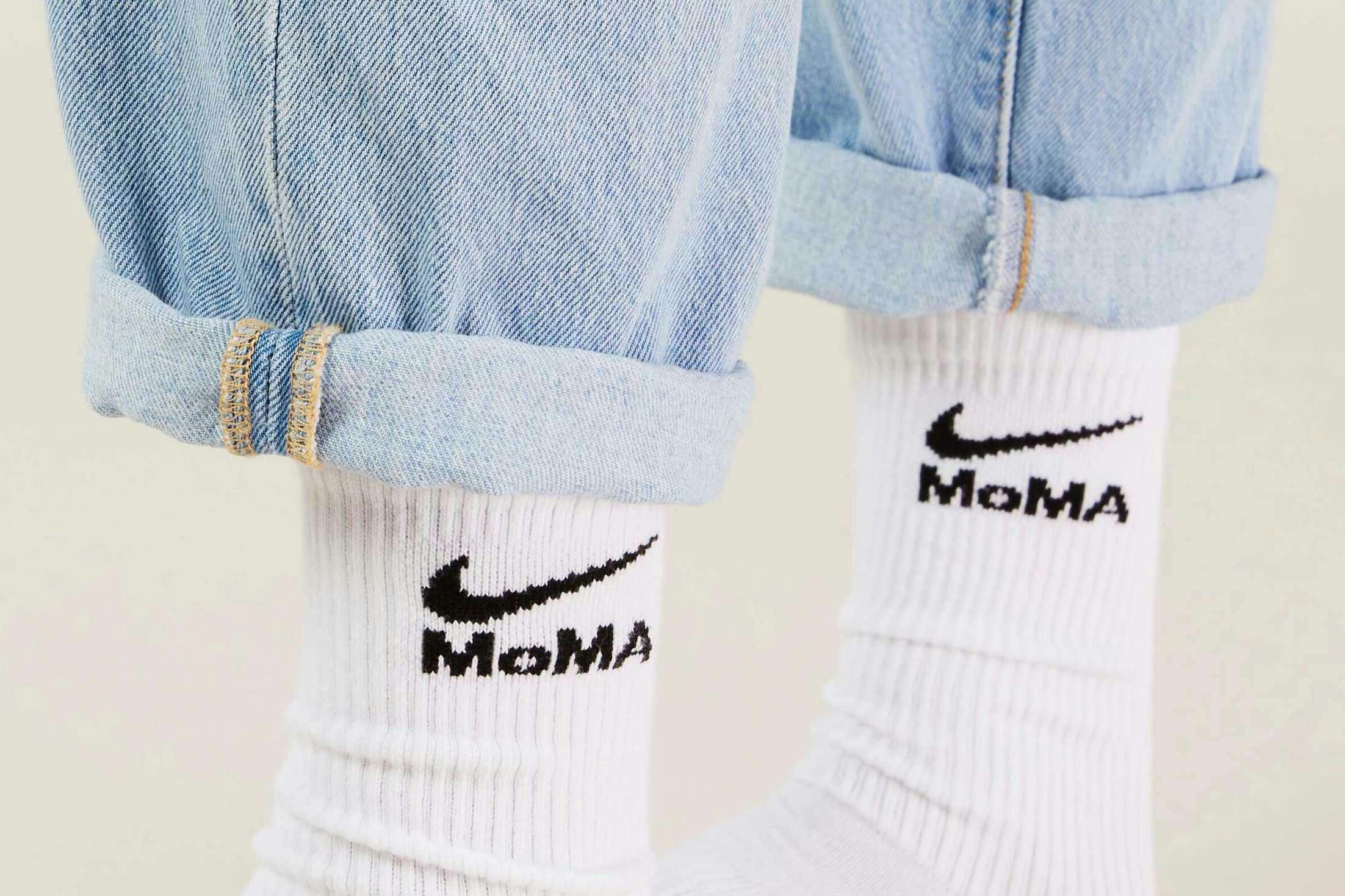 MoMA x Nike sock collaboration in white yellow green blue pink