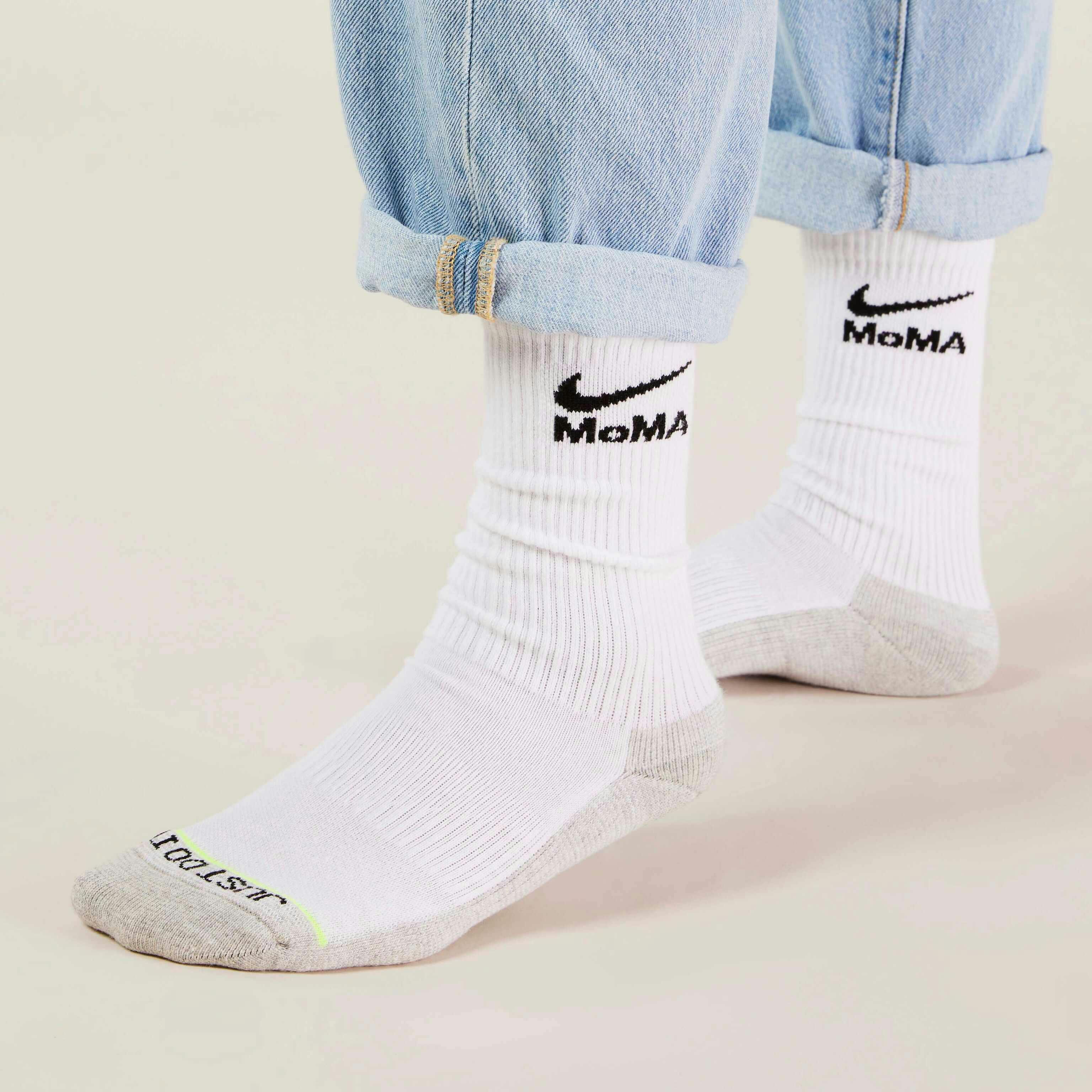 MoMA x Nike sock collaboration in white yellow green blue pink