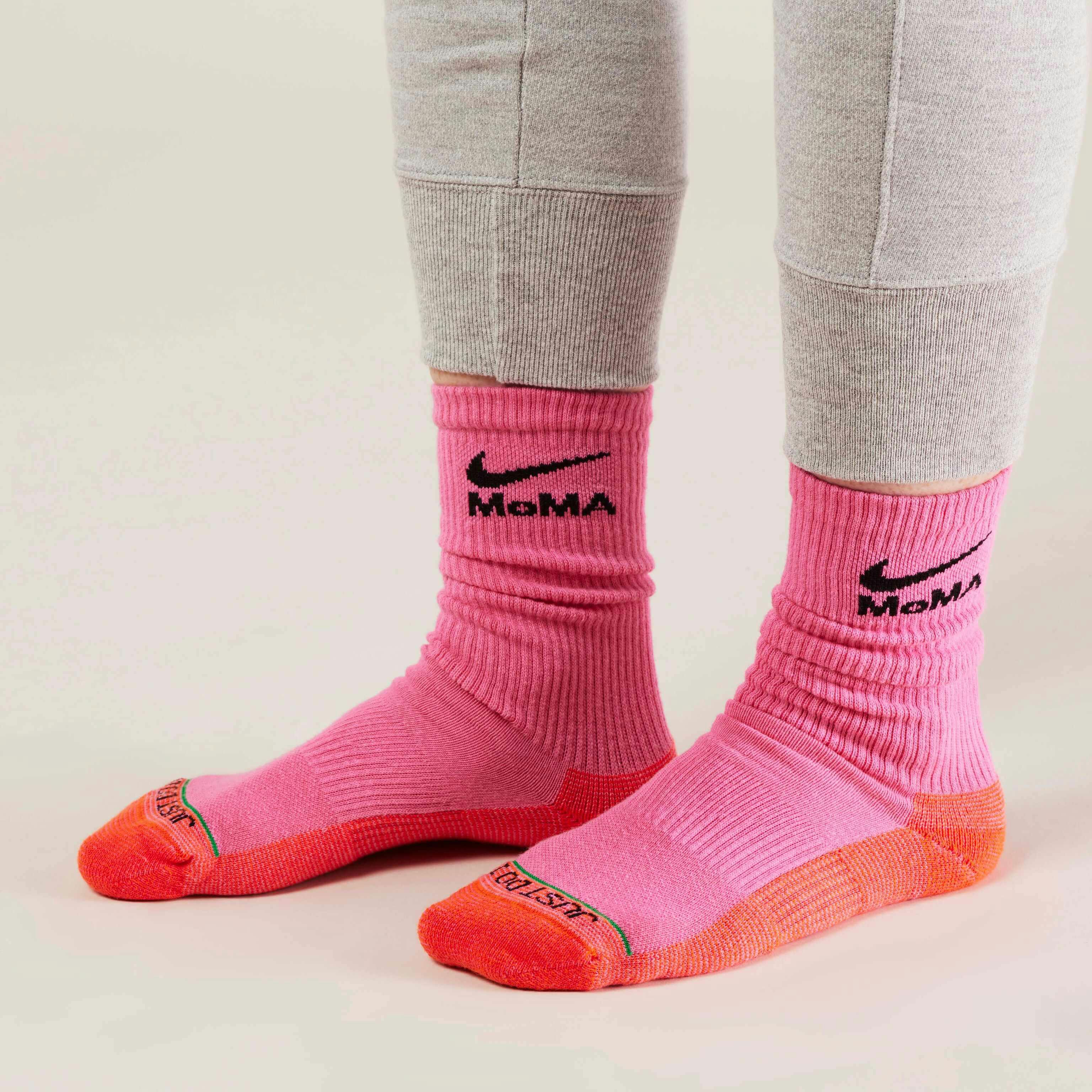 MoMA x Nike sock collaboration in white yellow green blue pink