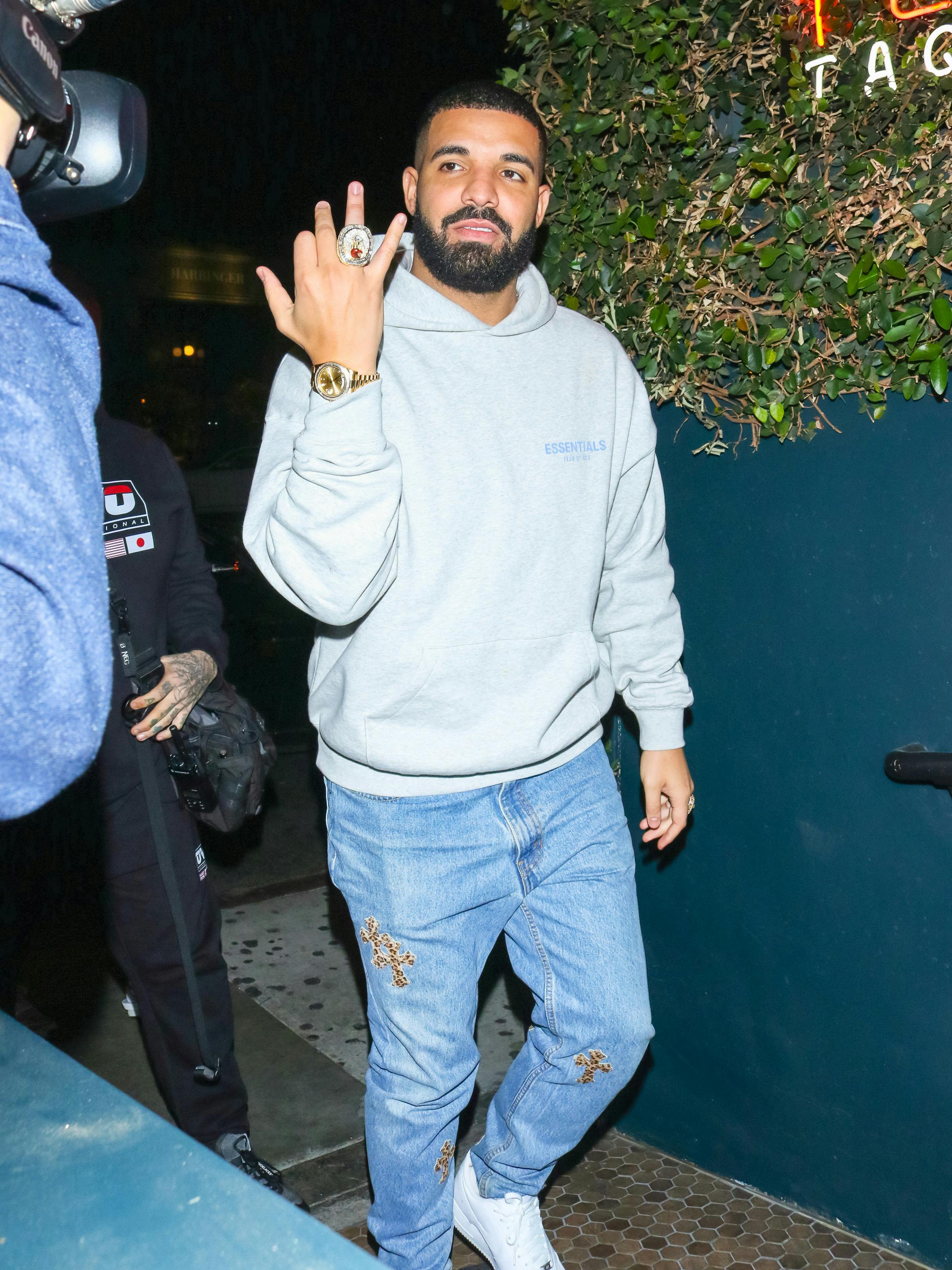 Drake watch collection, Drake wearing a rolex champagne dial with diamonds, grey hoodie