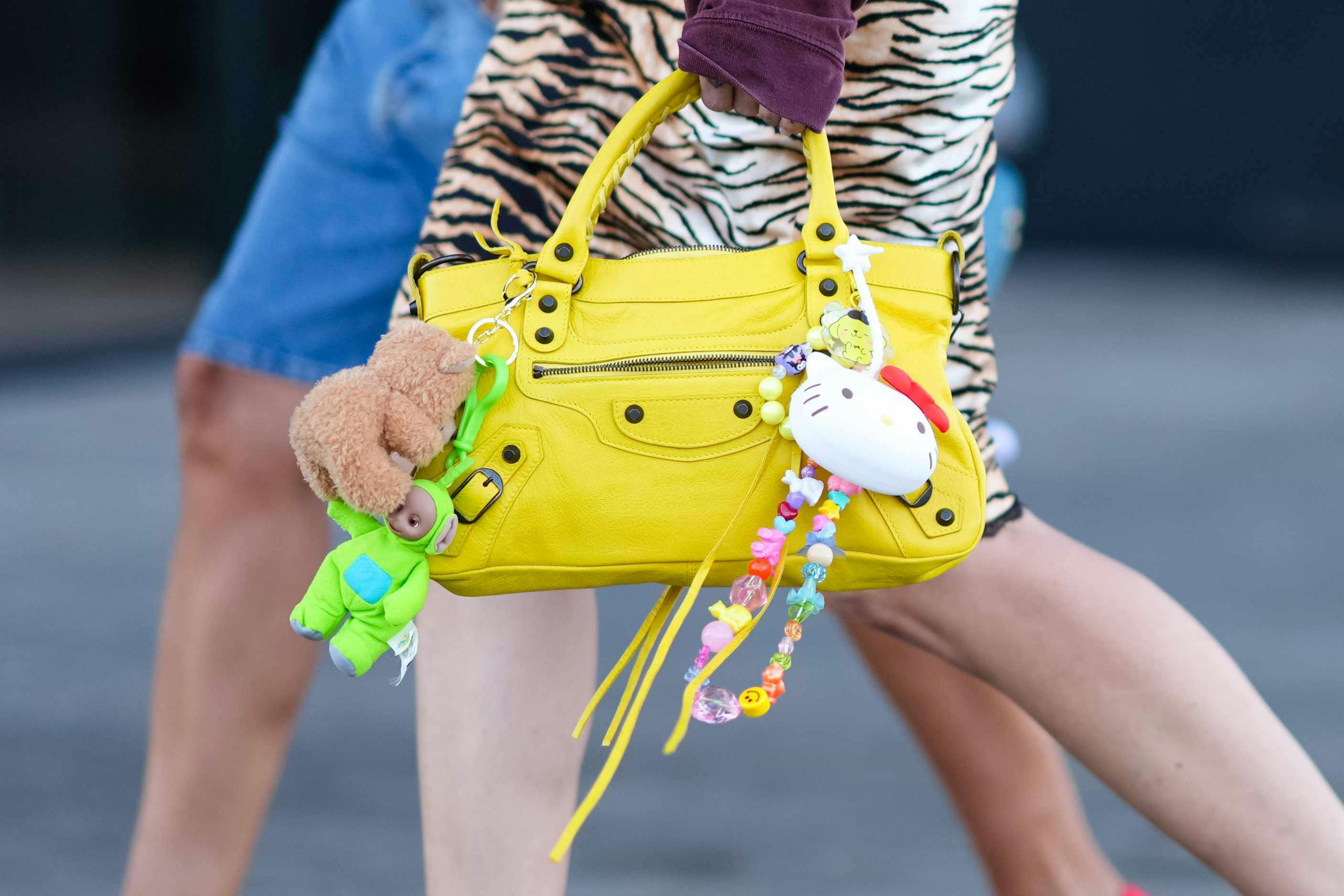 balenciaga yellow city bag with hello kitty charm