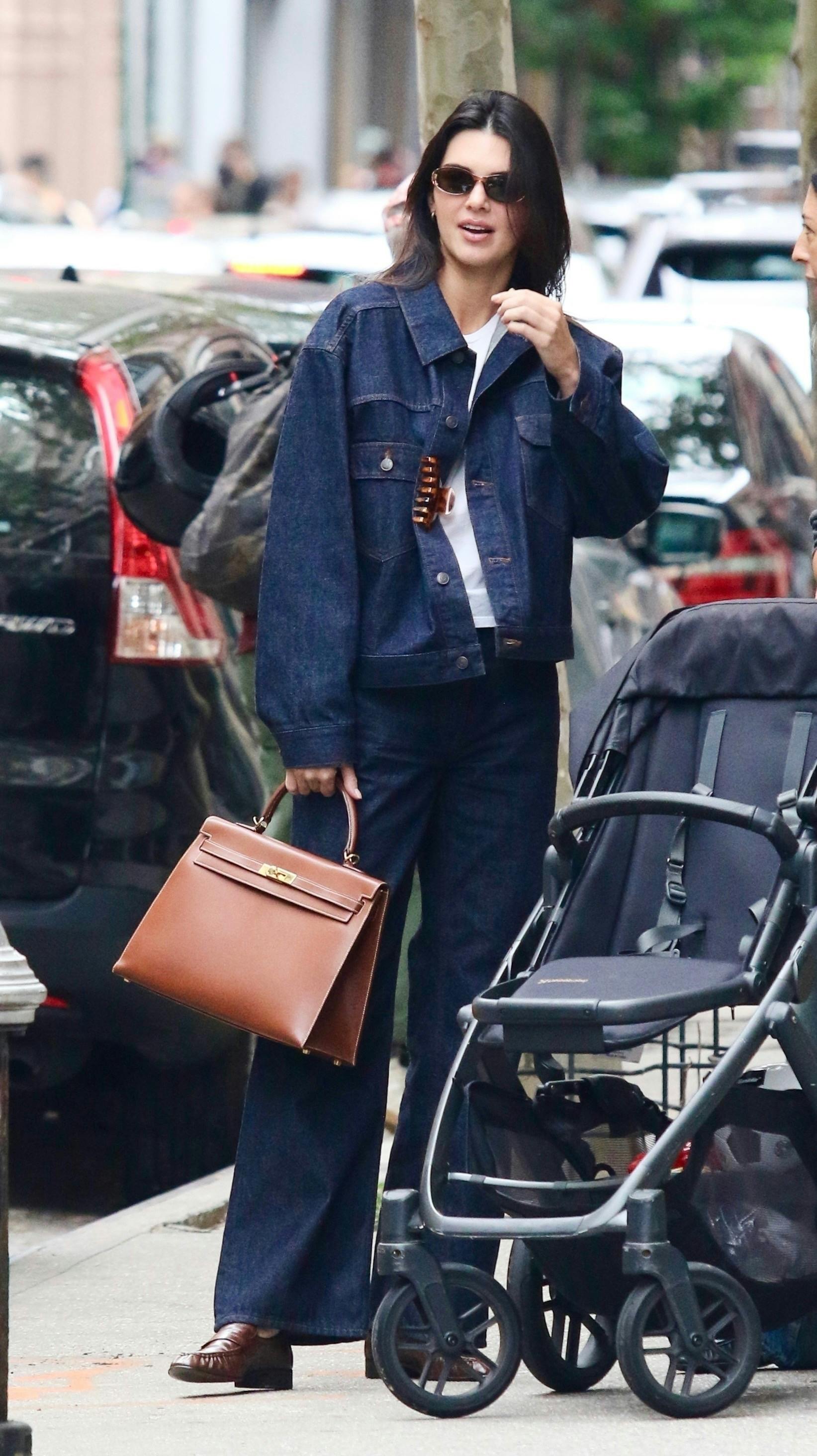 Kendall Jenner wearing a denim jacket and jeans Canadian Tuxedo in New York City