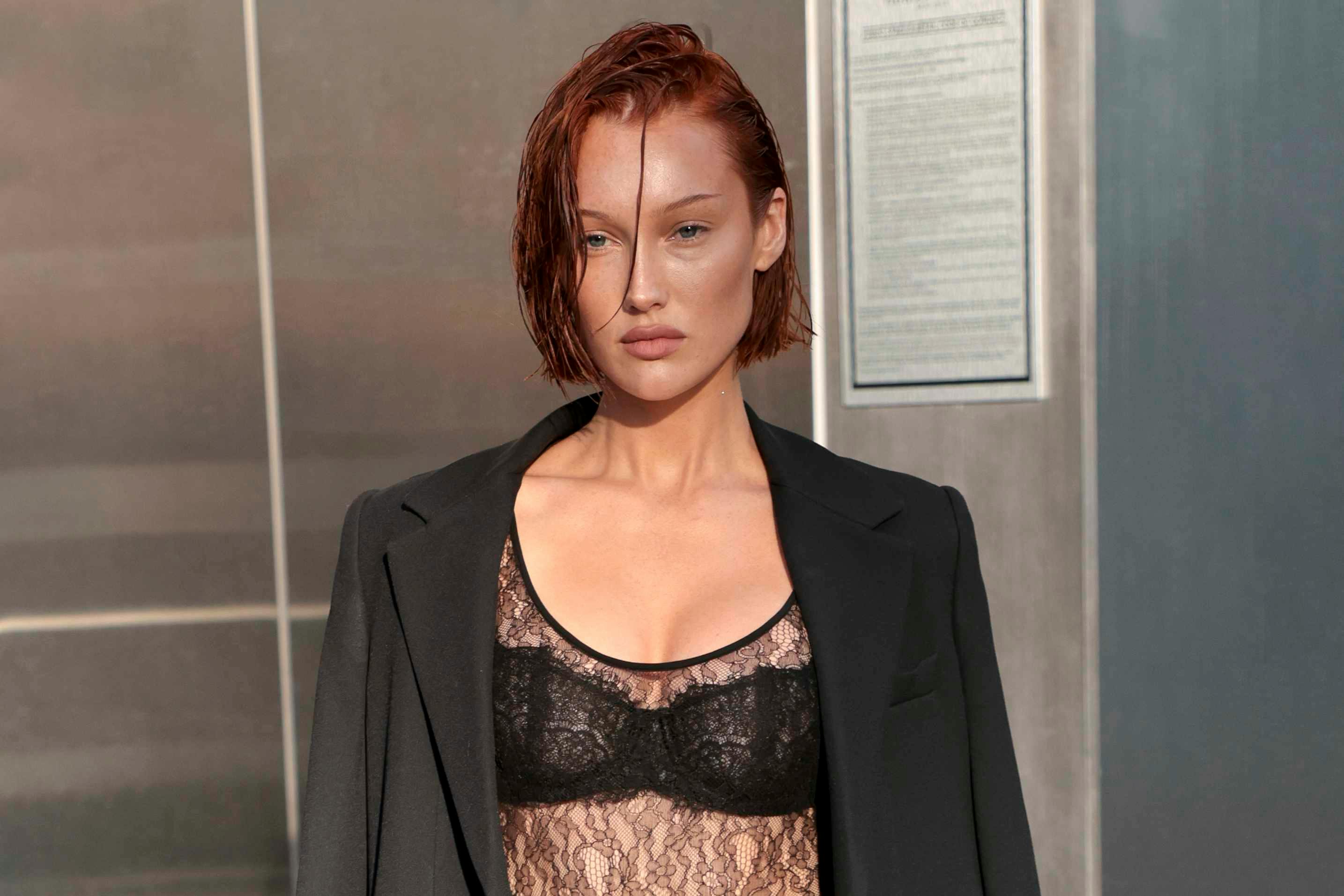 meredith duxbury at the michael kors fashion show in a blazer and lacy lingerie