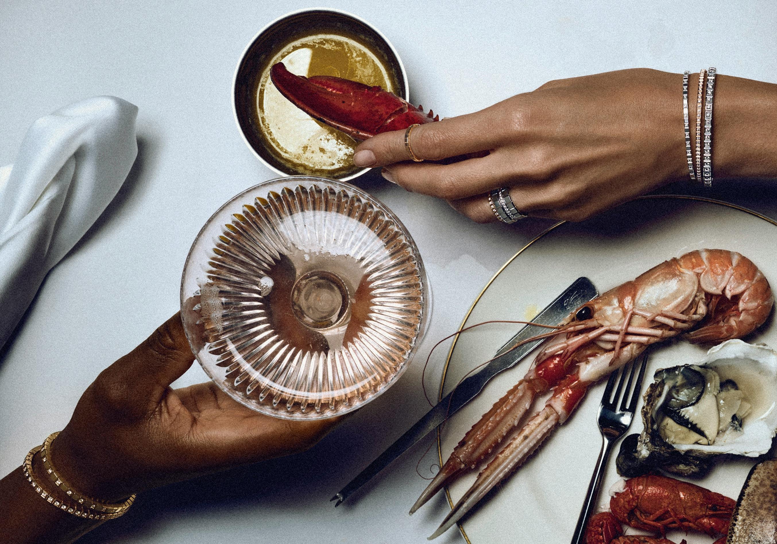 Chopard Ice Cube Collection photographed with a luxurious spread of seafood