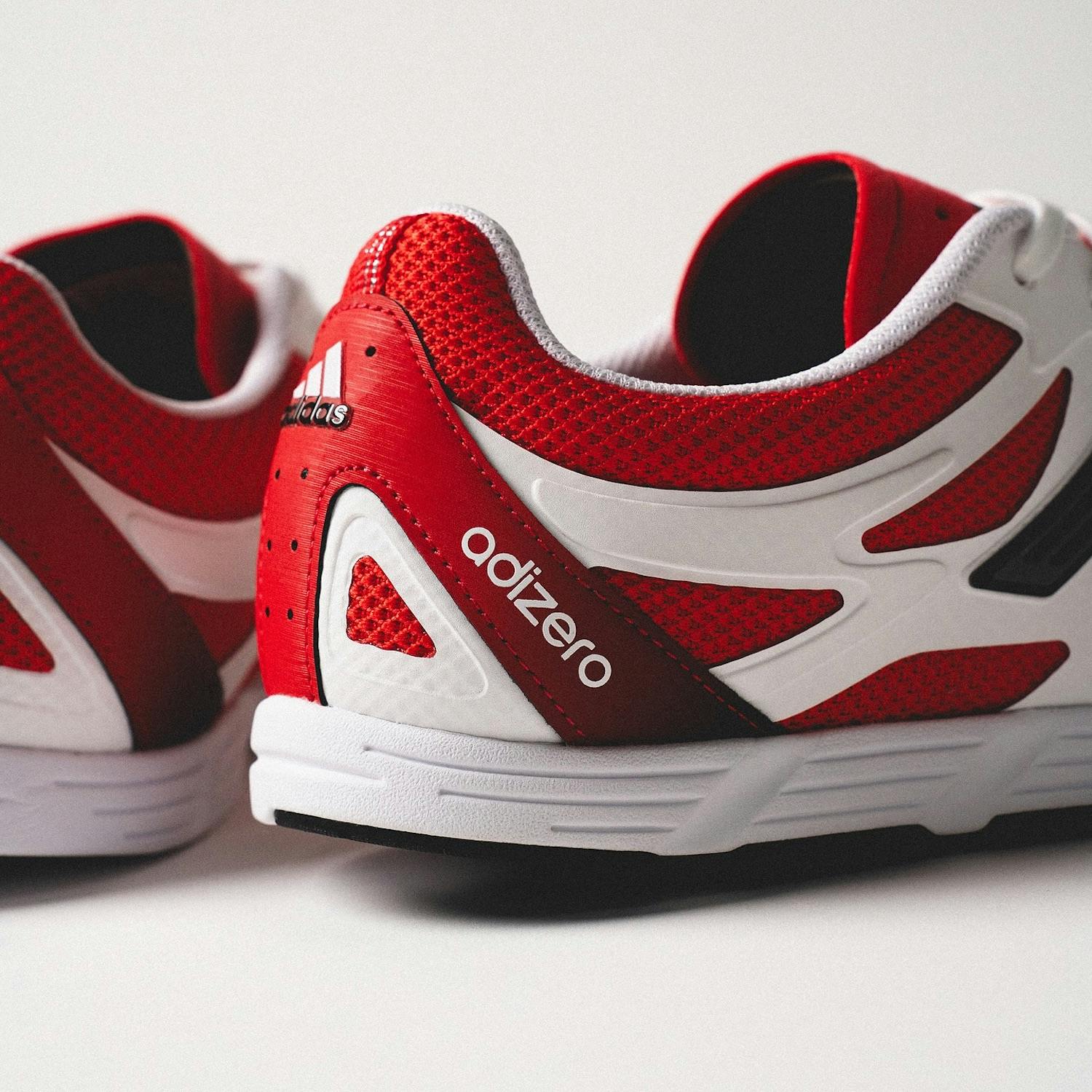 adidas adizero pr sneaker in red and white