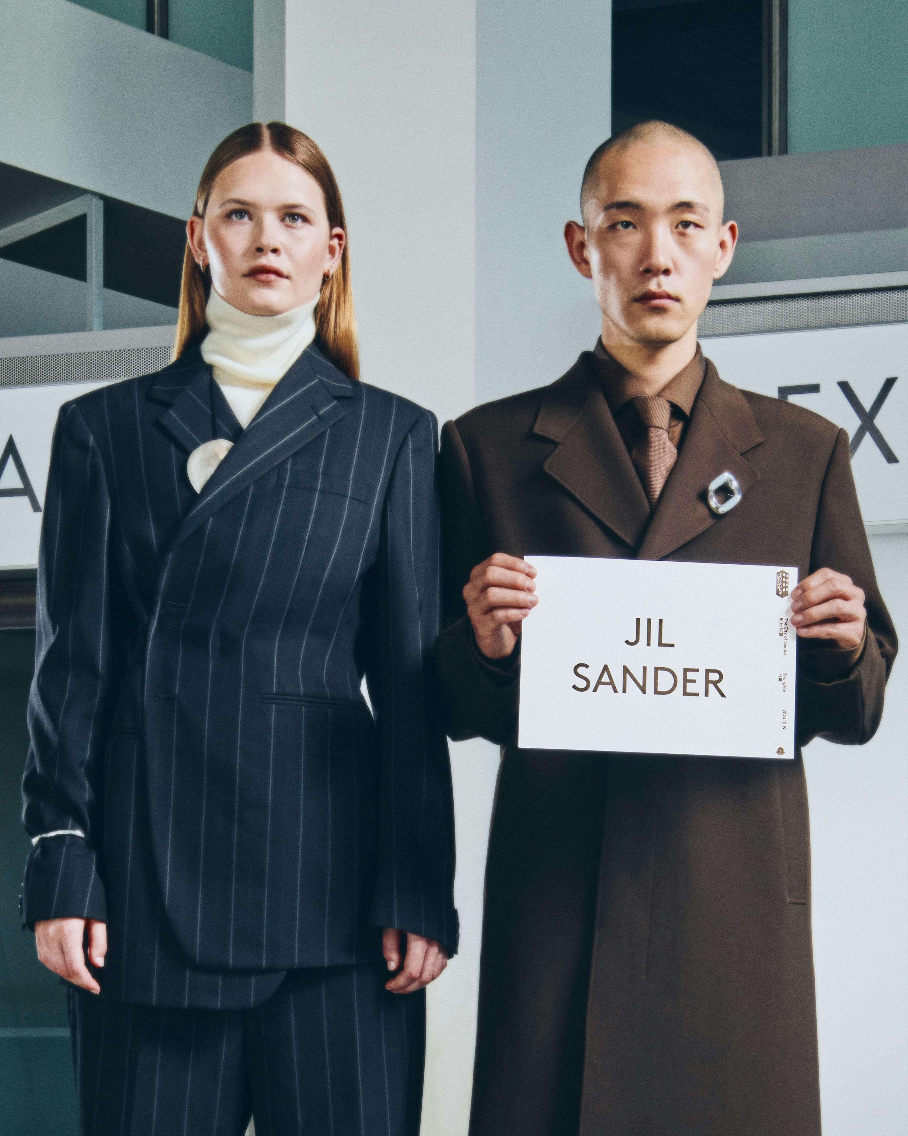 Moncler drivers holding name card with talent name to pick them up from airport