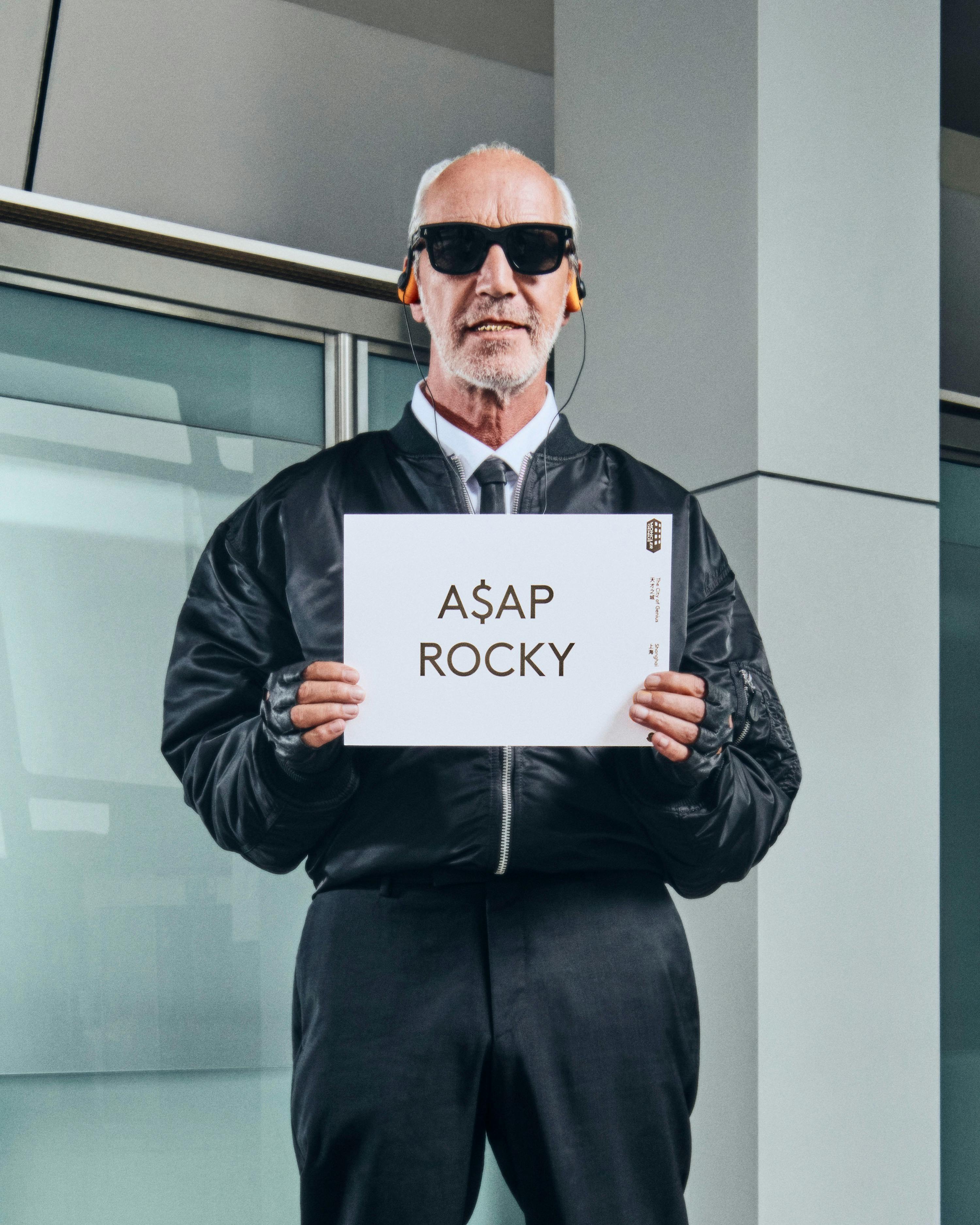 Moncler drivers holding name card with talent name to pick them up from airport