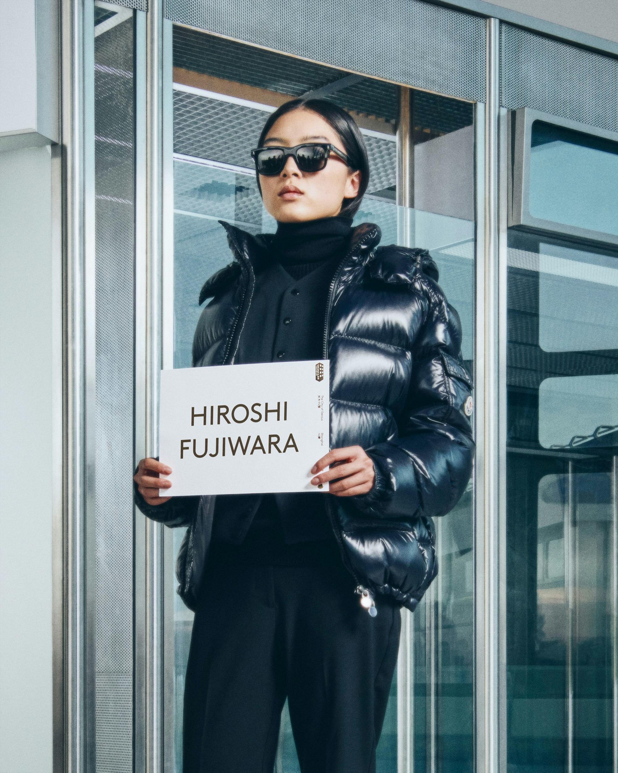 Moncler drivers holding name card with talent name to pick them up from airport