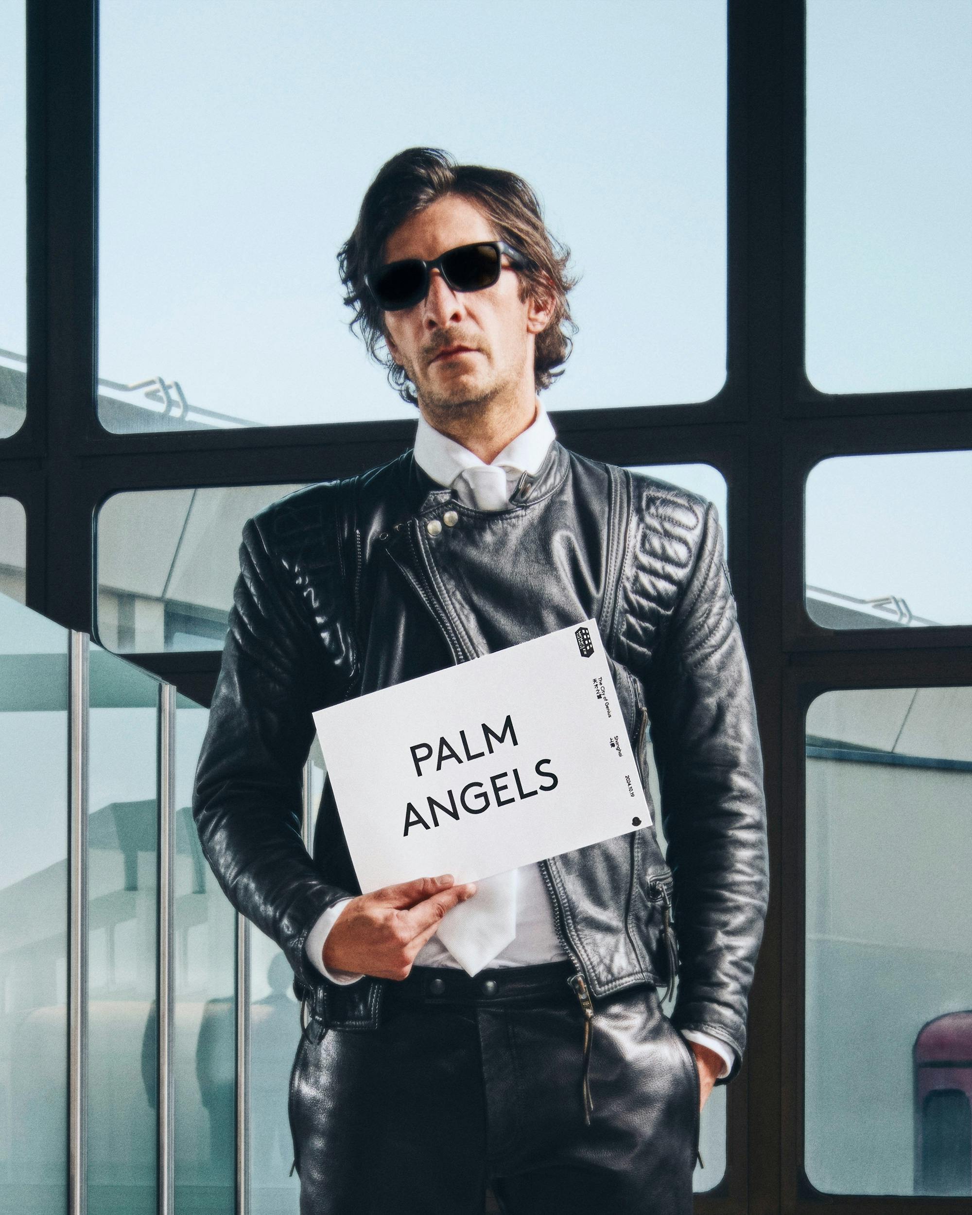 Moncler drivers holding name card with talent name to pick them up from airport