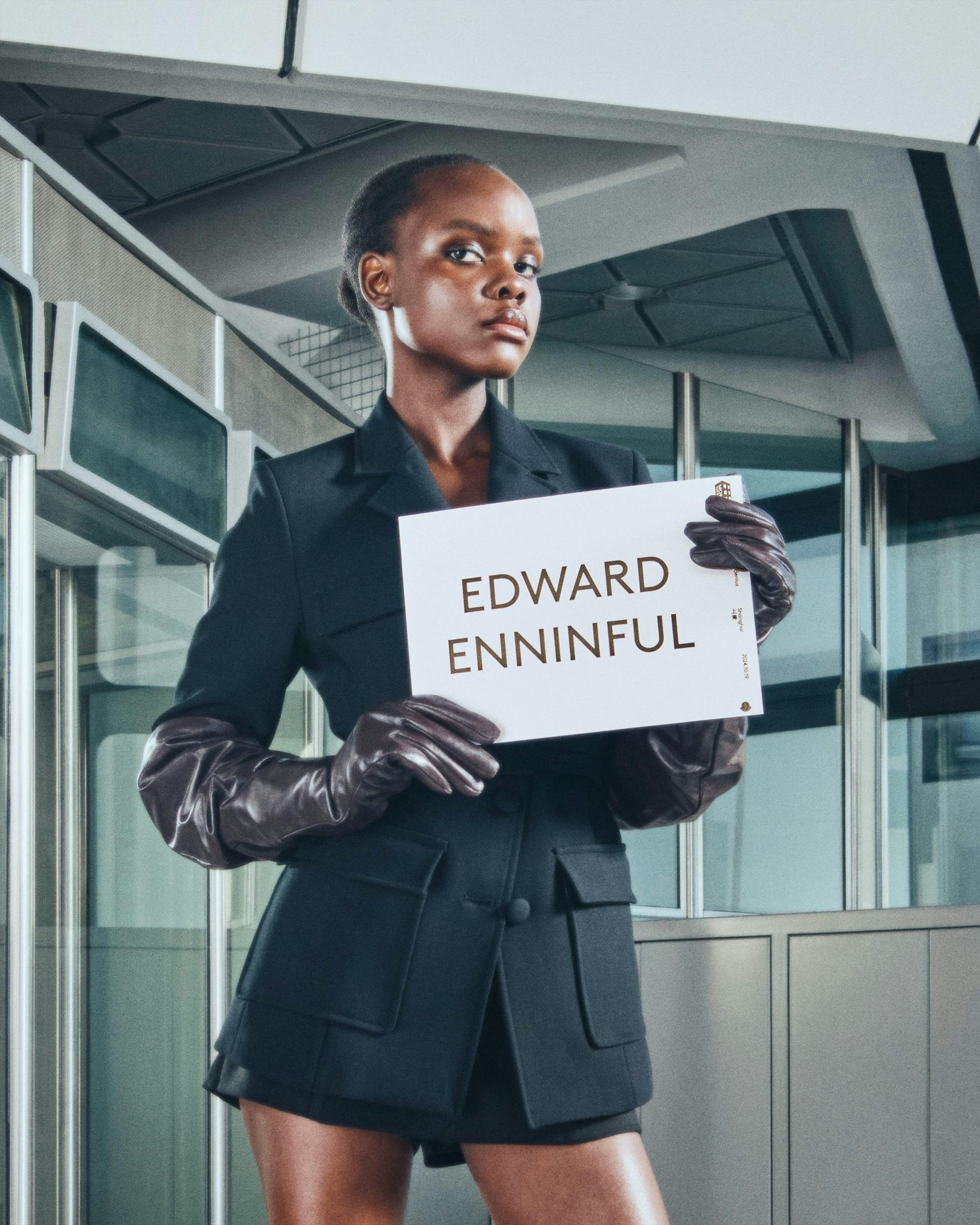 Moncler drivers holding name card with talent name to pick them up from airport