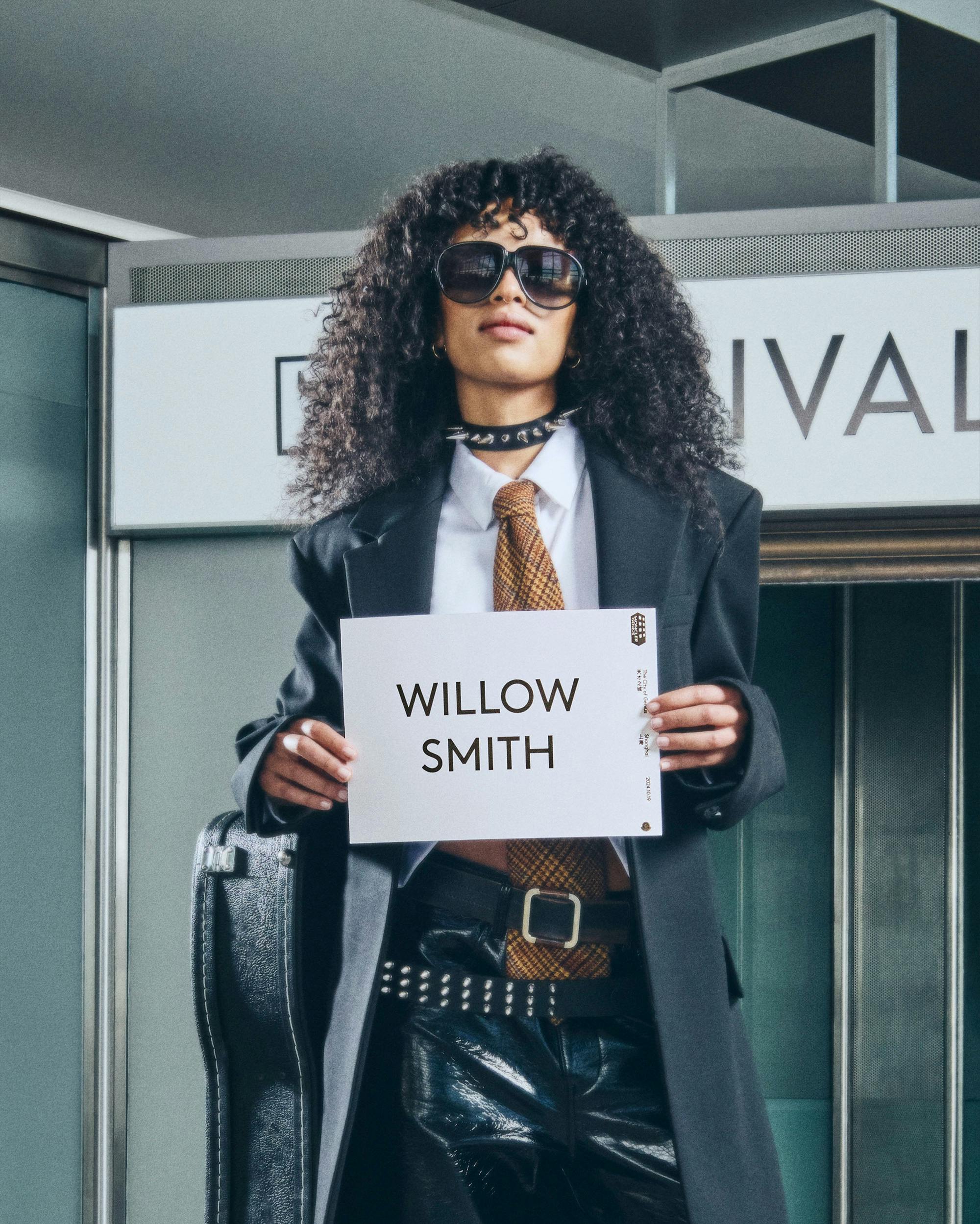 Moncler drivers holding name card with talent name to pick them up from airport