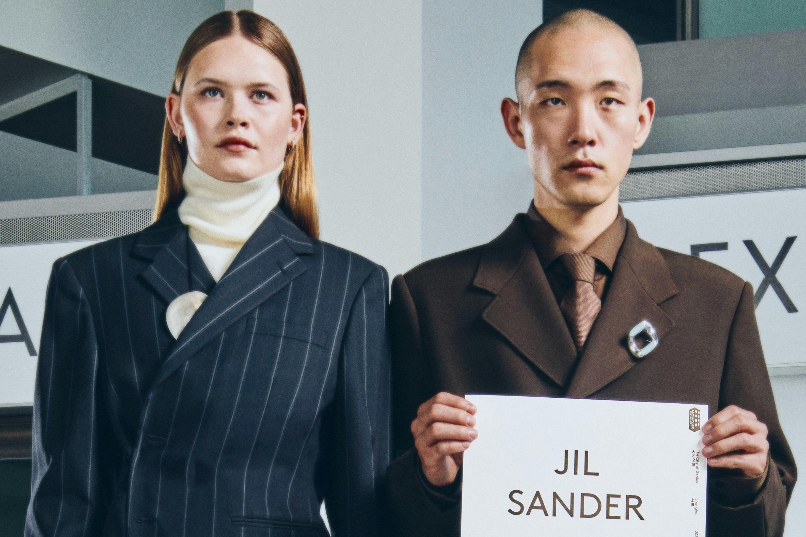 Moncler drivers holding name card with talent name to pick them up from airport