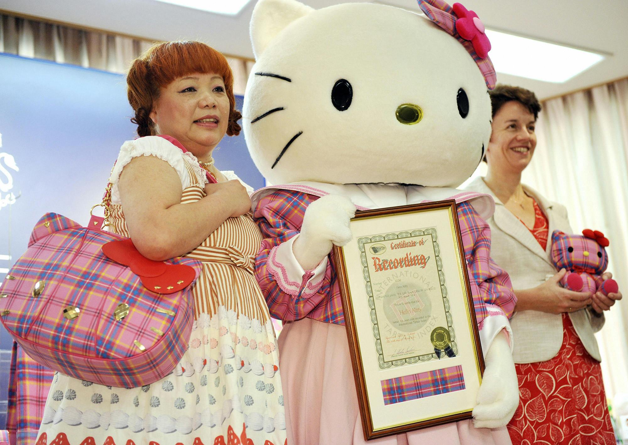 Hello Kitty designer Yuko Yamaguchi (on left) debuts a tartan Hello Kitty collection at the British Embassy in 2009.