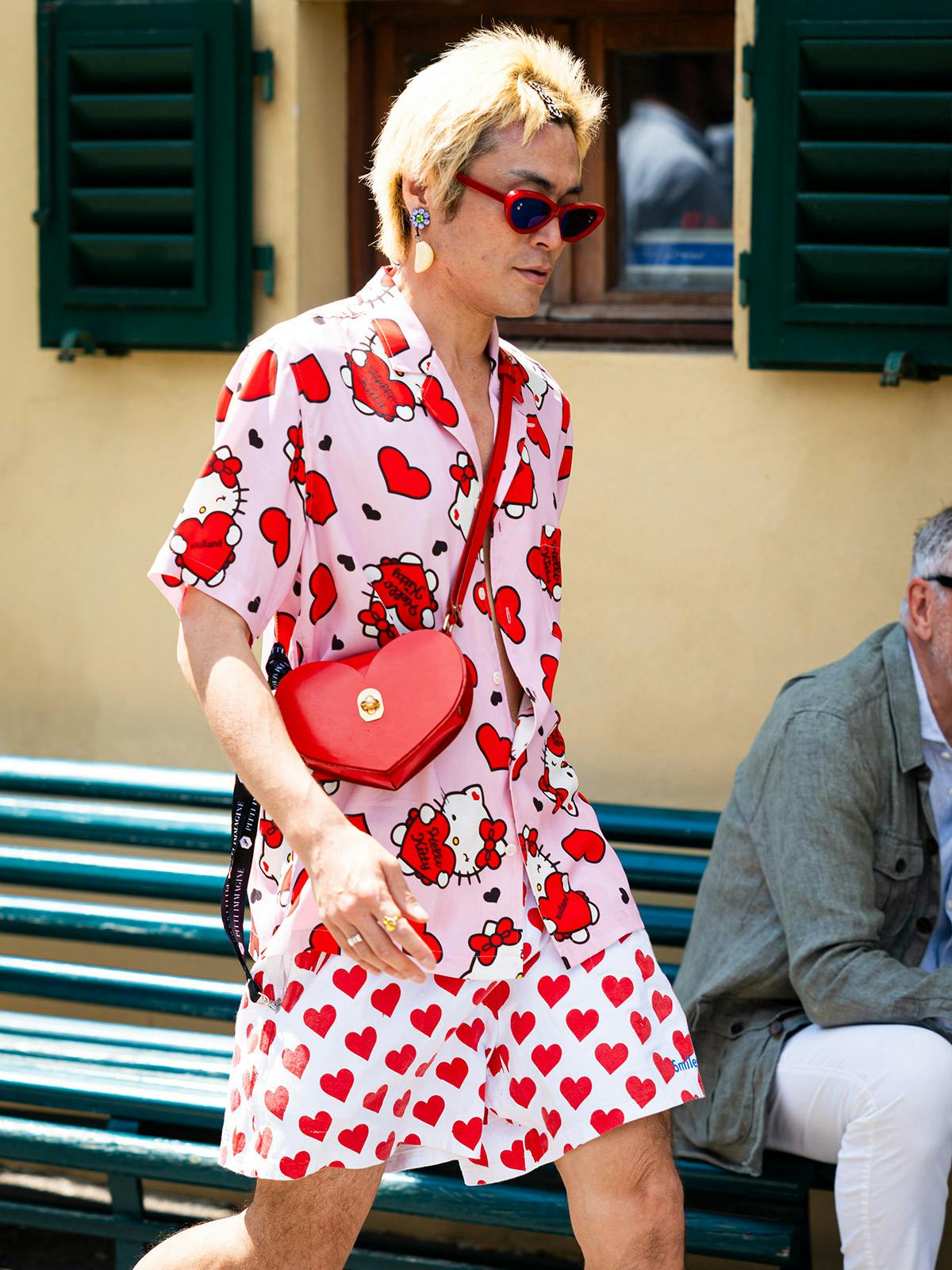 Influencer Yu Masui wearing a pink Hello Kitty shirt at 2023’s Pitti Immagine Uomo 104.