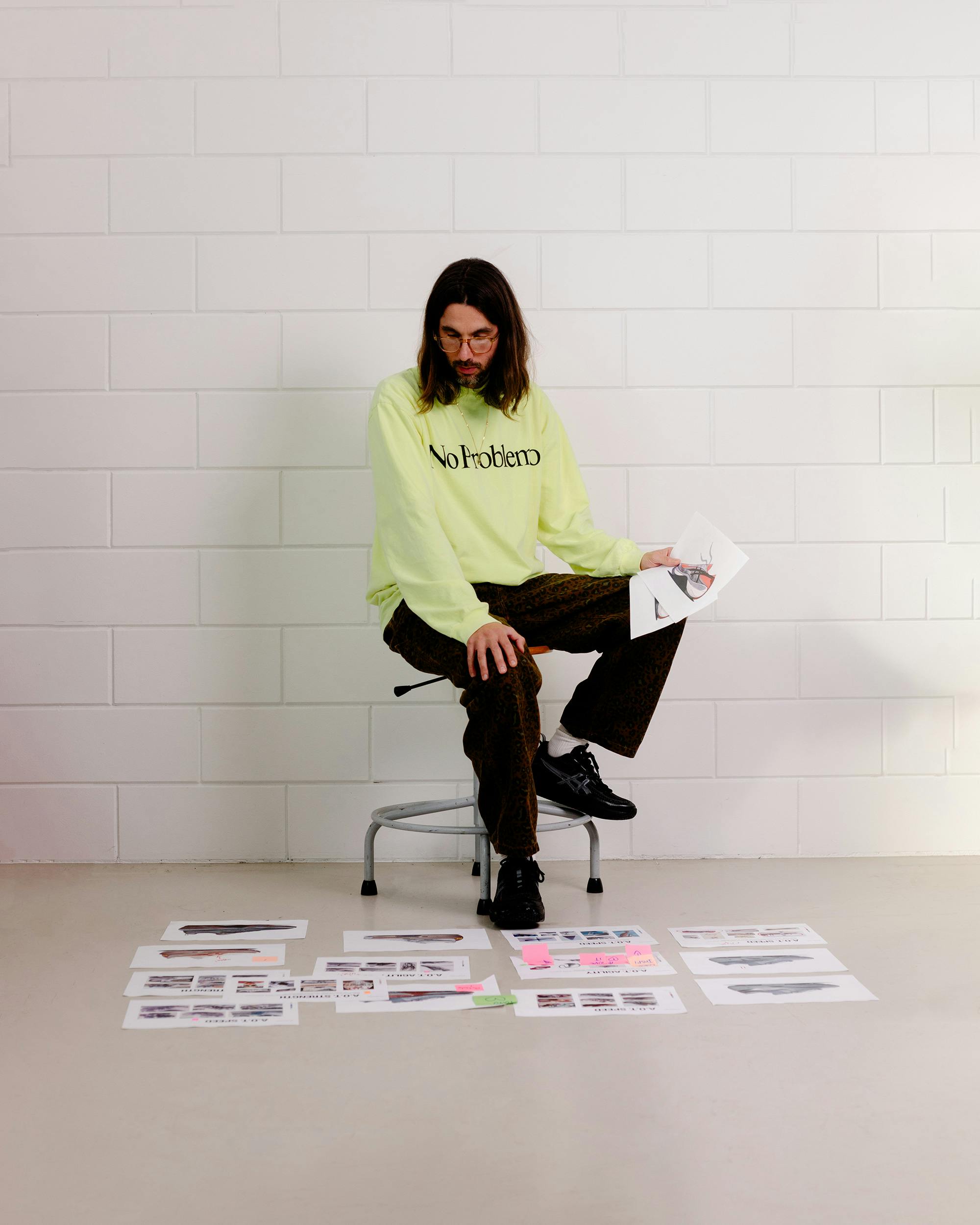 Mathieu from Studio HAGEL sitting on a stool