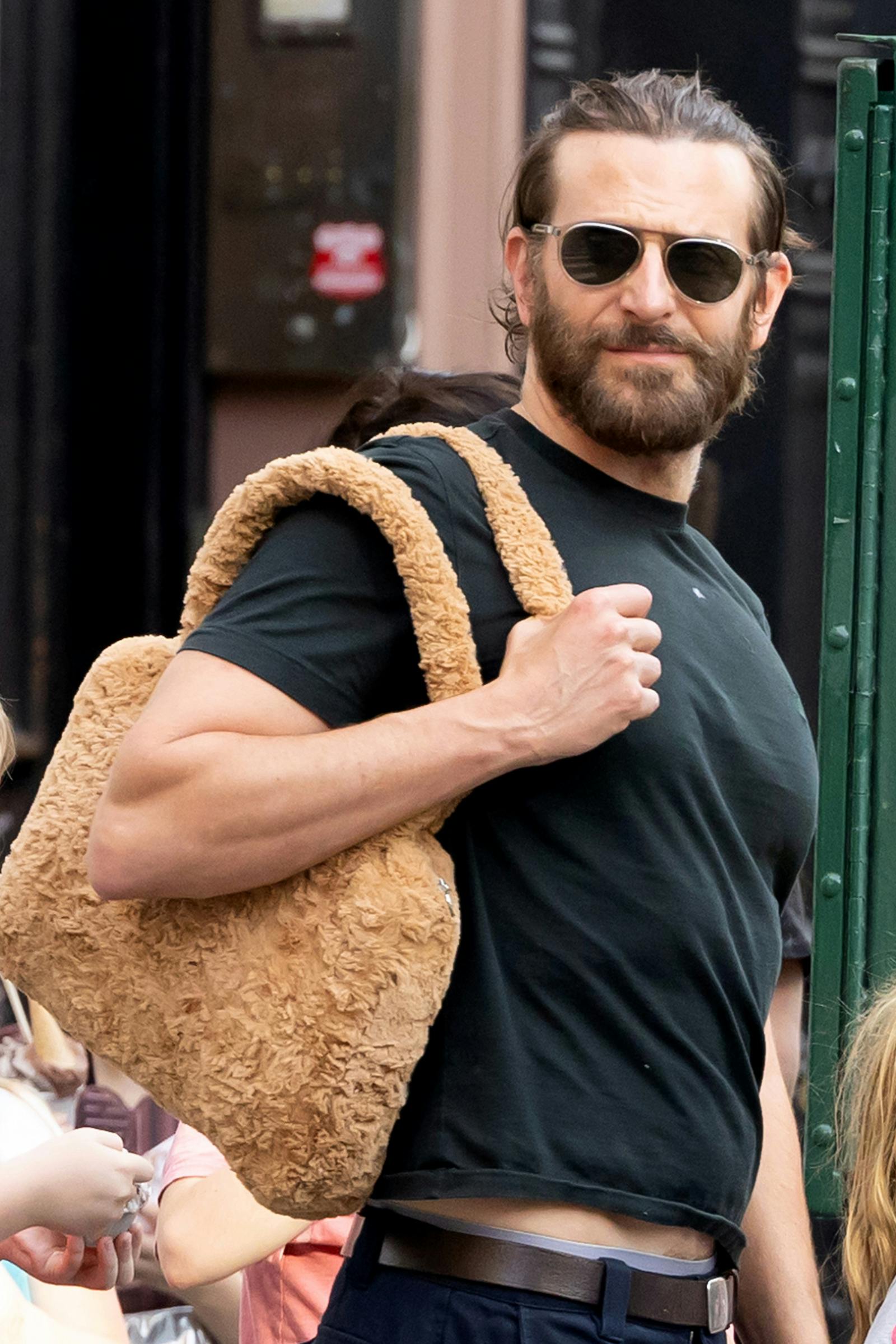 Bradley Cooper wearing his daughter's fuzzy purse