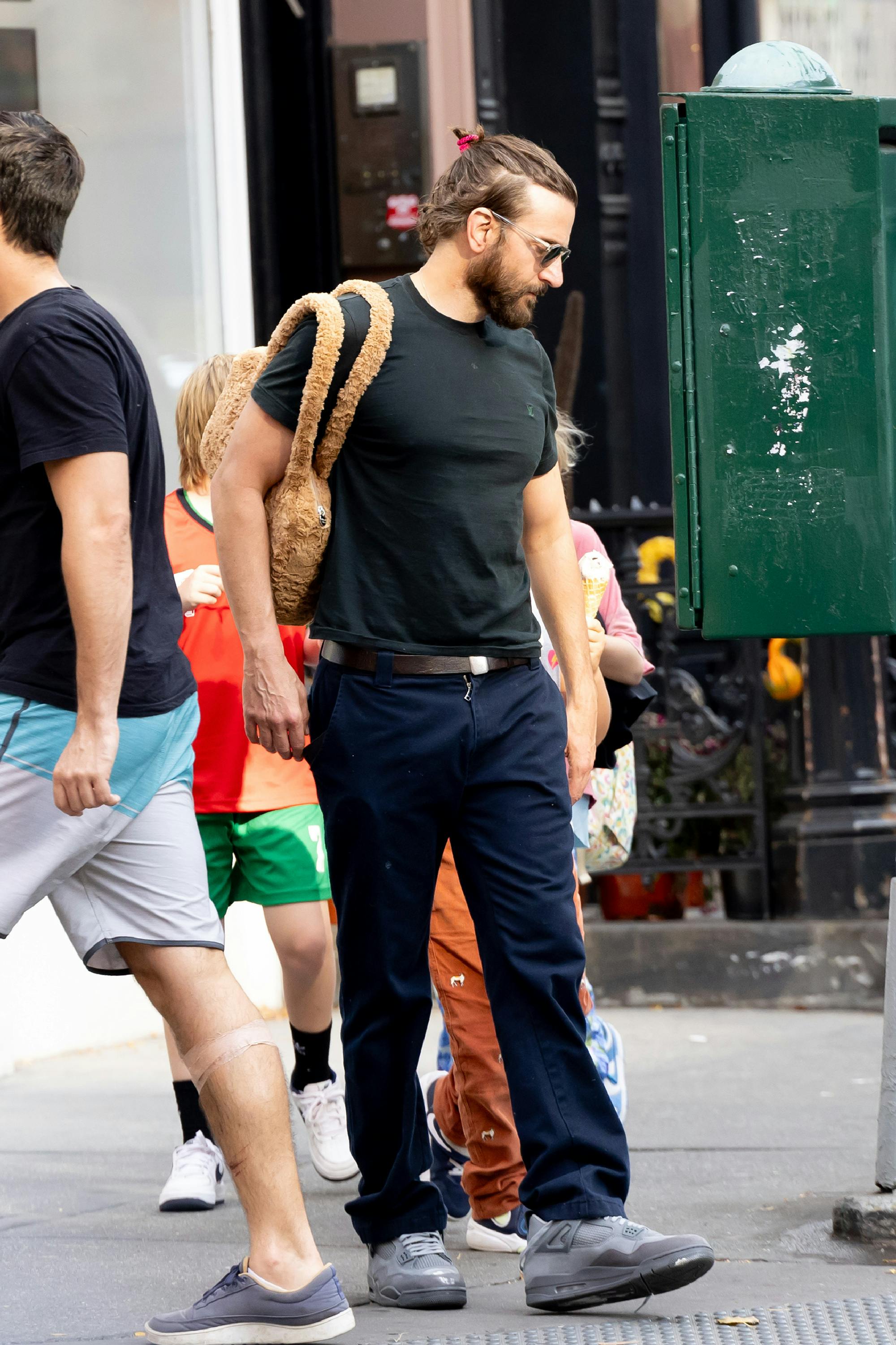 Bradley Cooper wearing his daughter's fuzzy purse