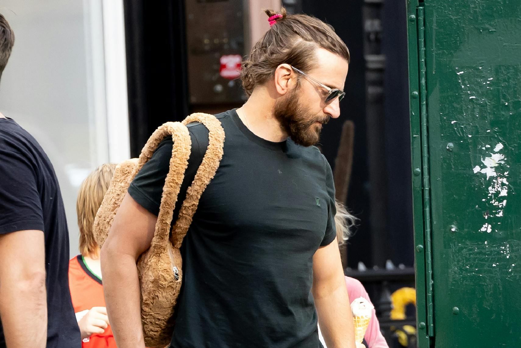 Bradley Cooper wearing his daughter's fuzzy purse