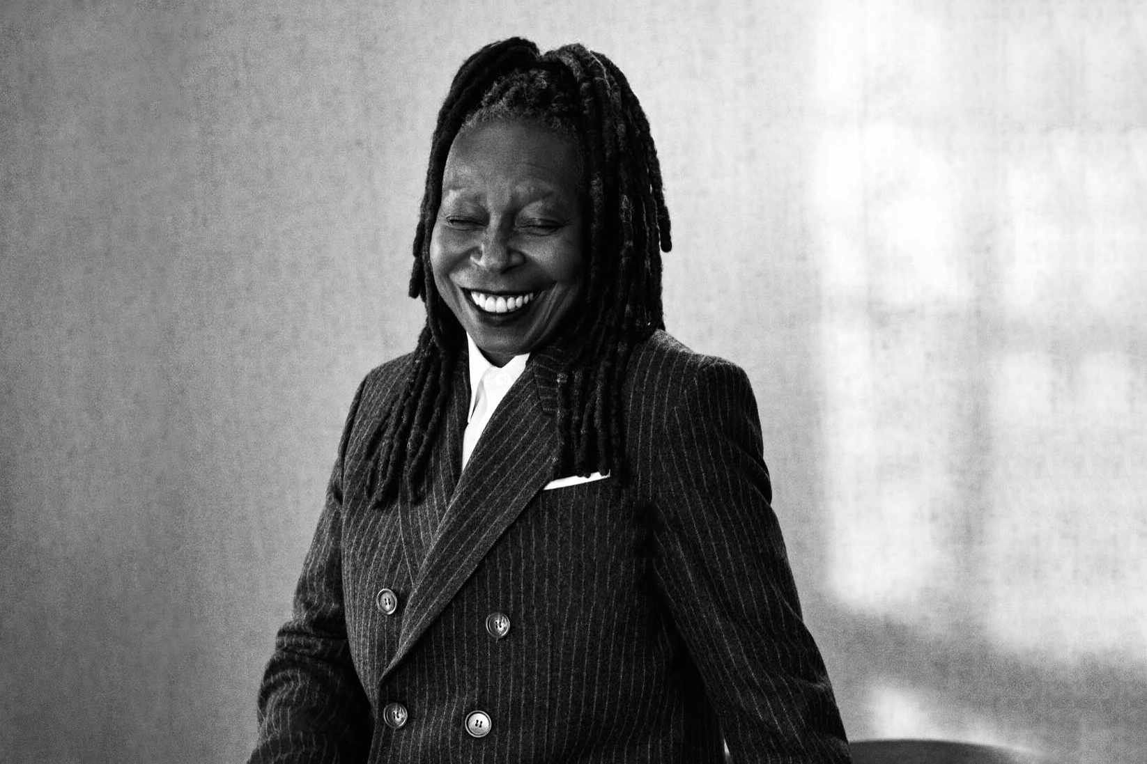 whoopi goldberg wearing an ami striped suit