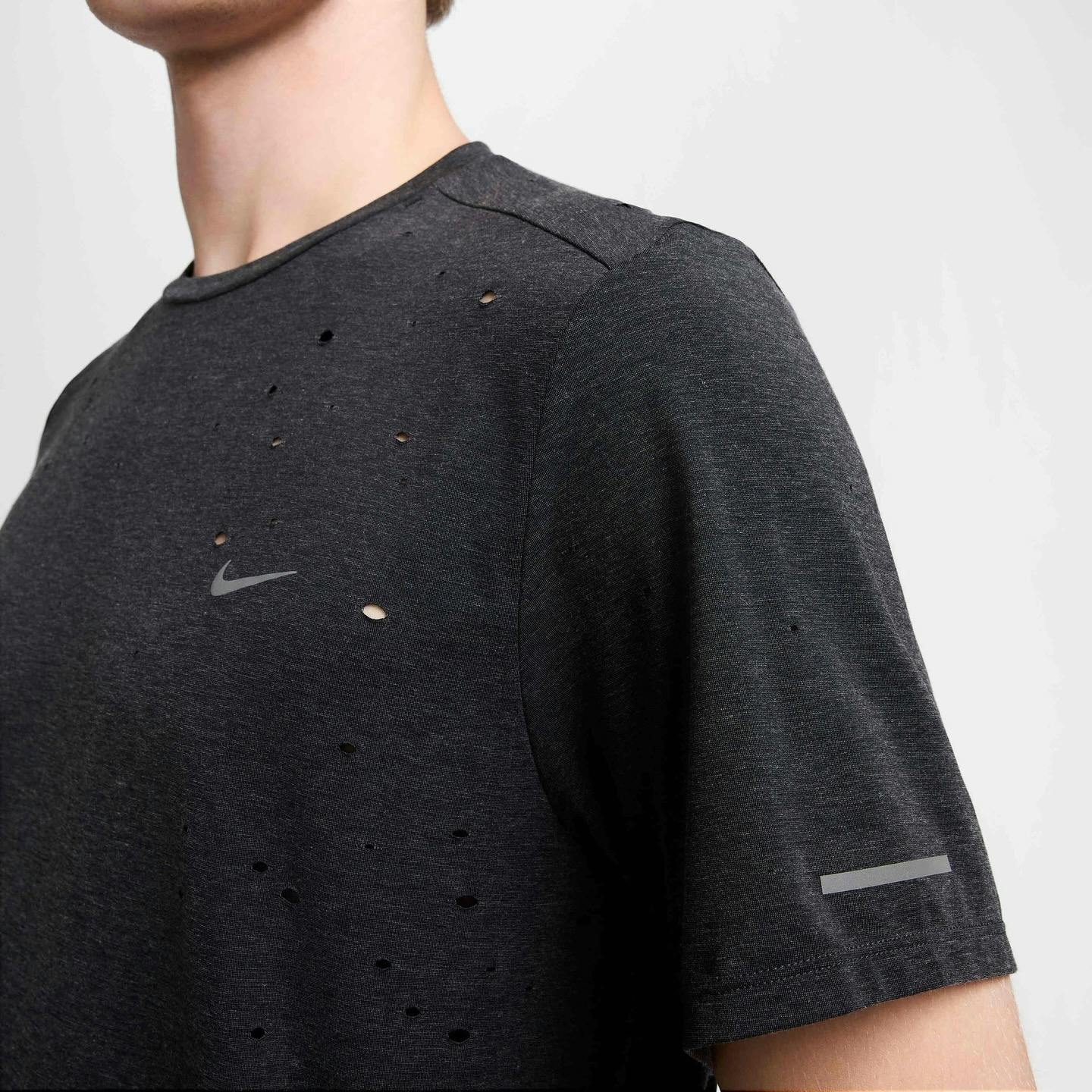 nike drifit shirt in black that looks like satisfy's mothtech shirt