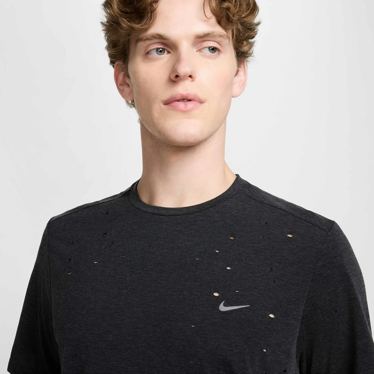 nike drifit shirt in black that looks like satisfy's mothtech shirt