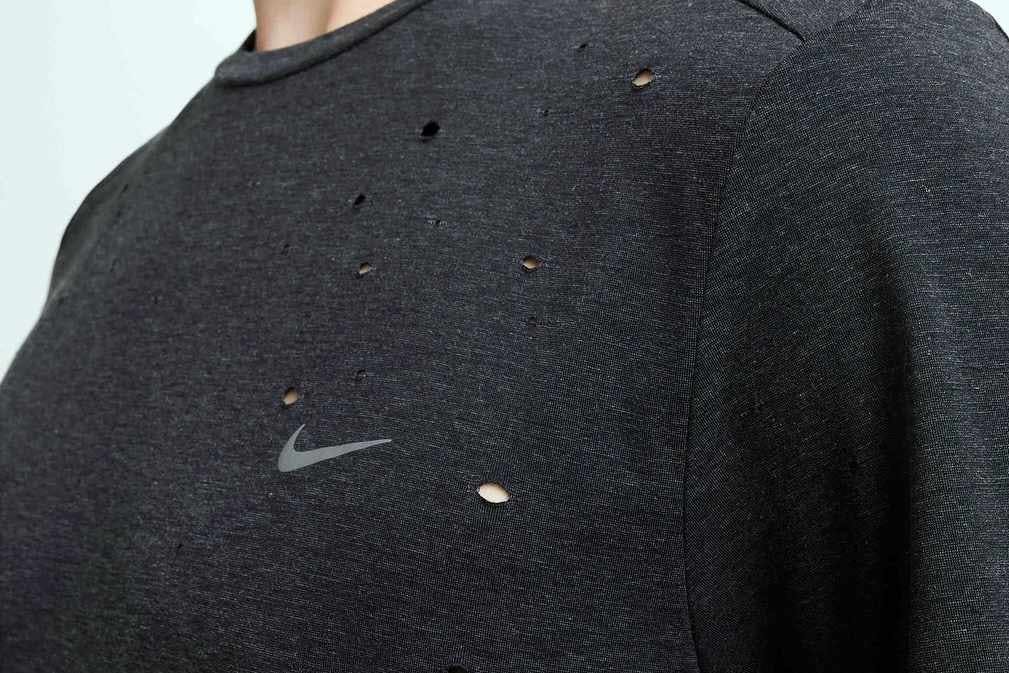 nike drifit shirt in black that looks like satisfy's mothtech shirt