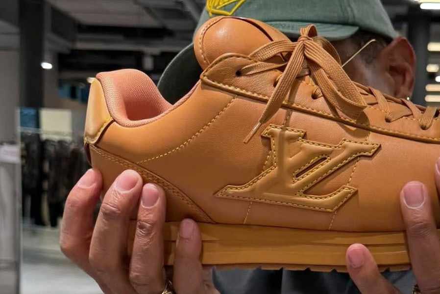 pharrell's buttersoft louis vuitton sneaker from fw25 in orange leather