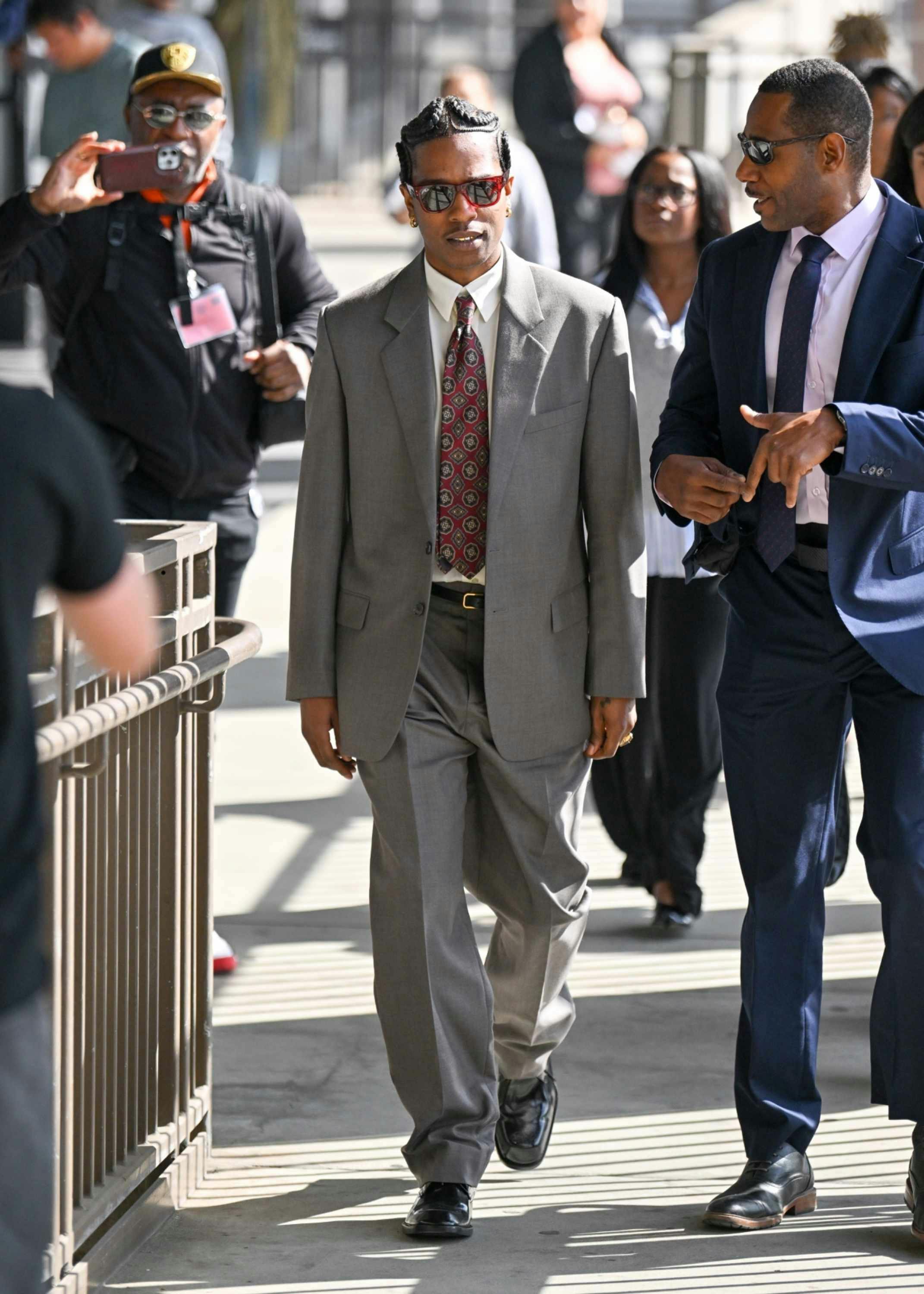 asap rocky wears a grey suit to his los angeles gun trial