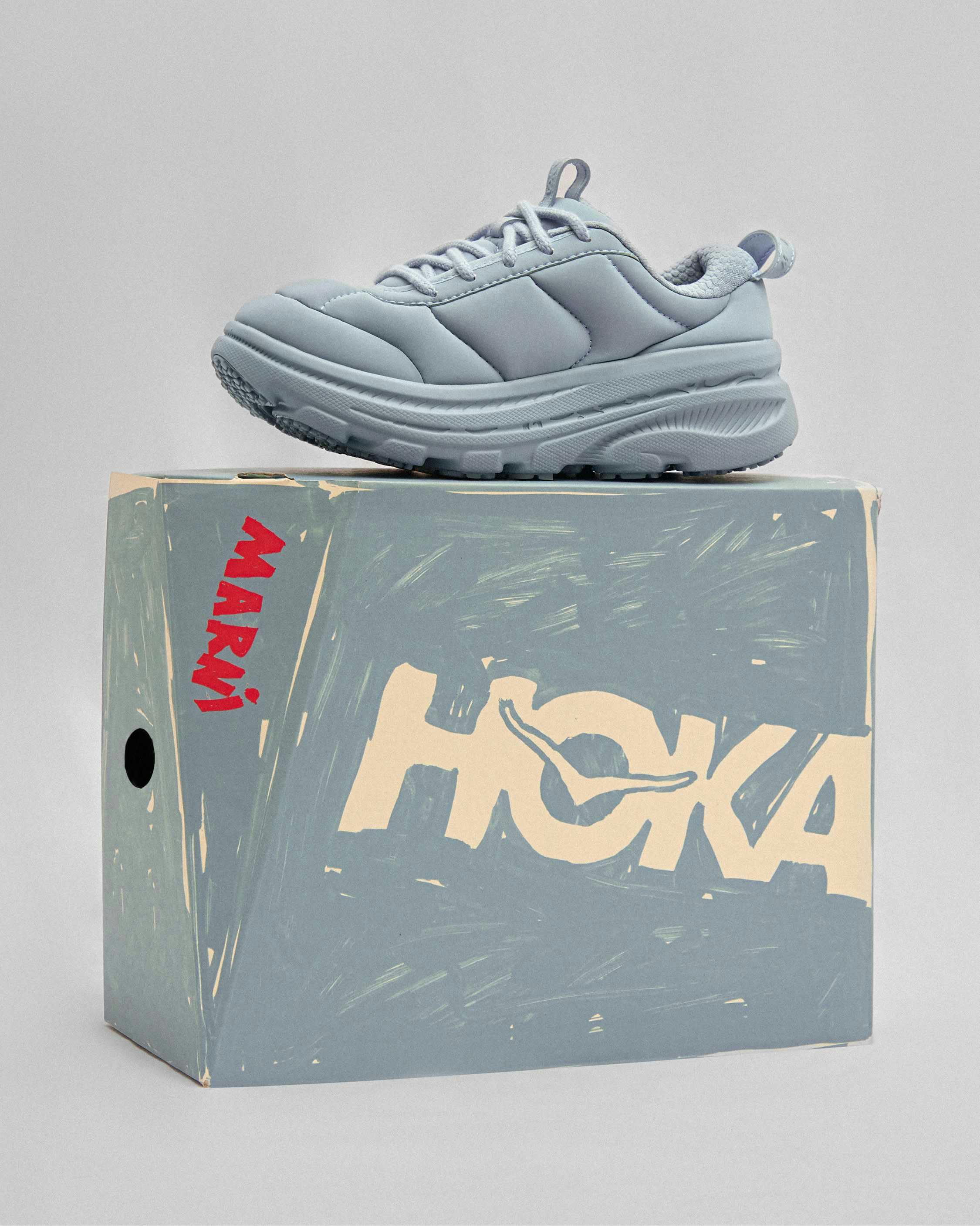 hoka marni sneaker in red, gold, black, blue colorways