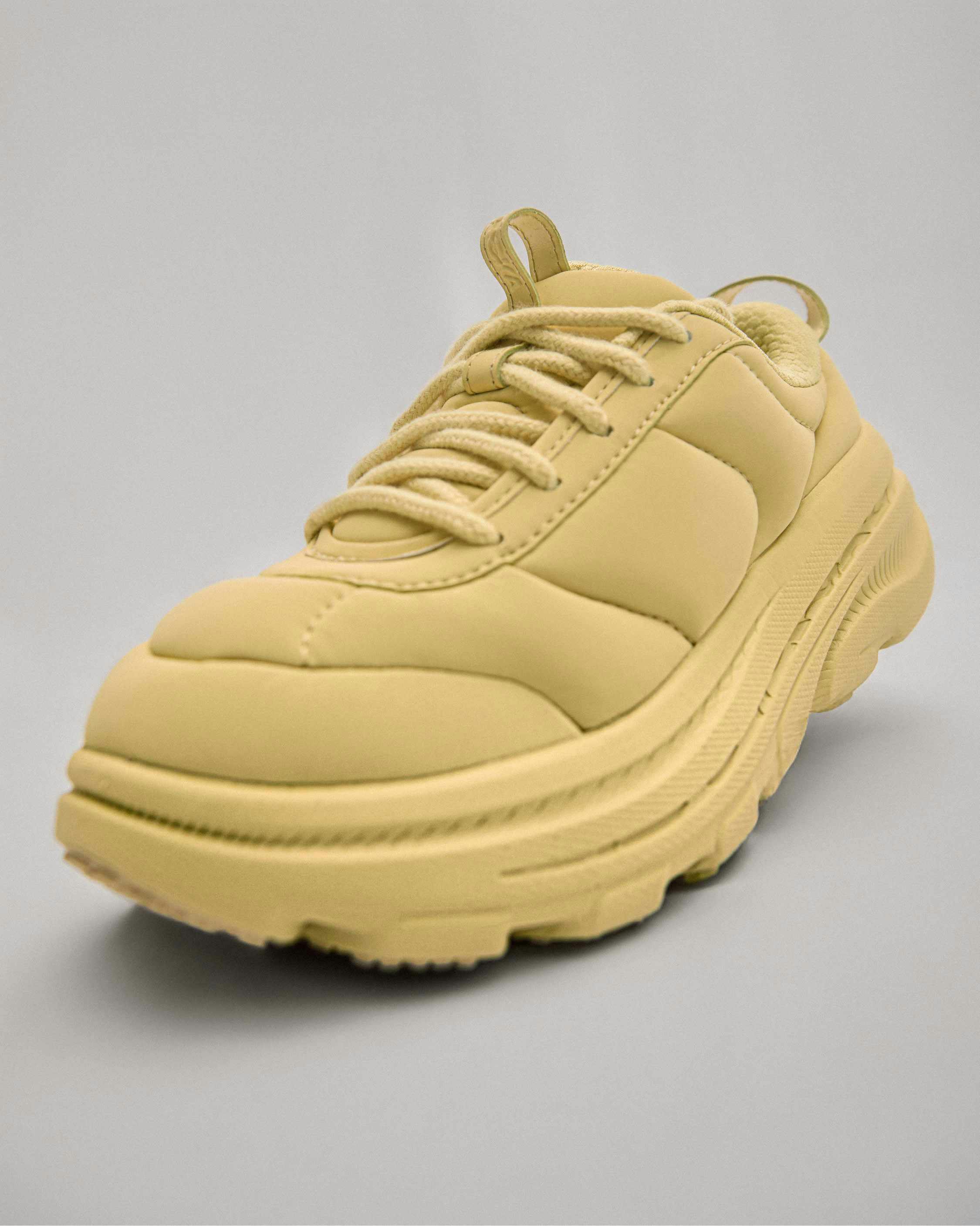 hoka marni sneaker in red, gold, black, blue colorways