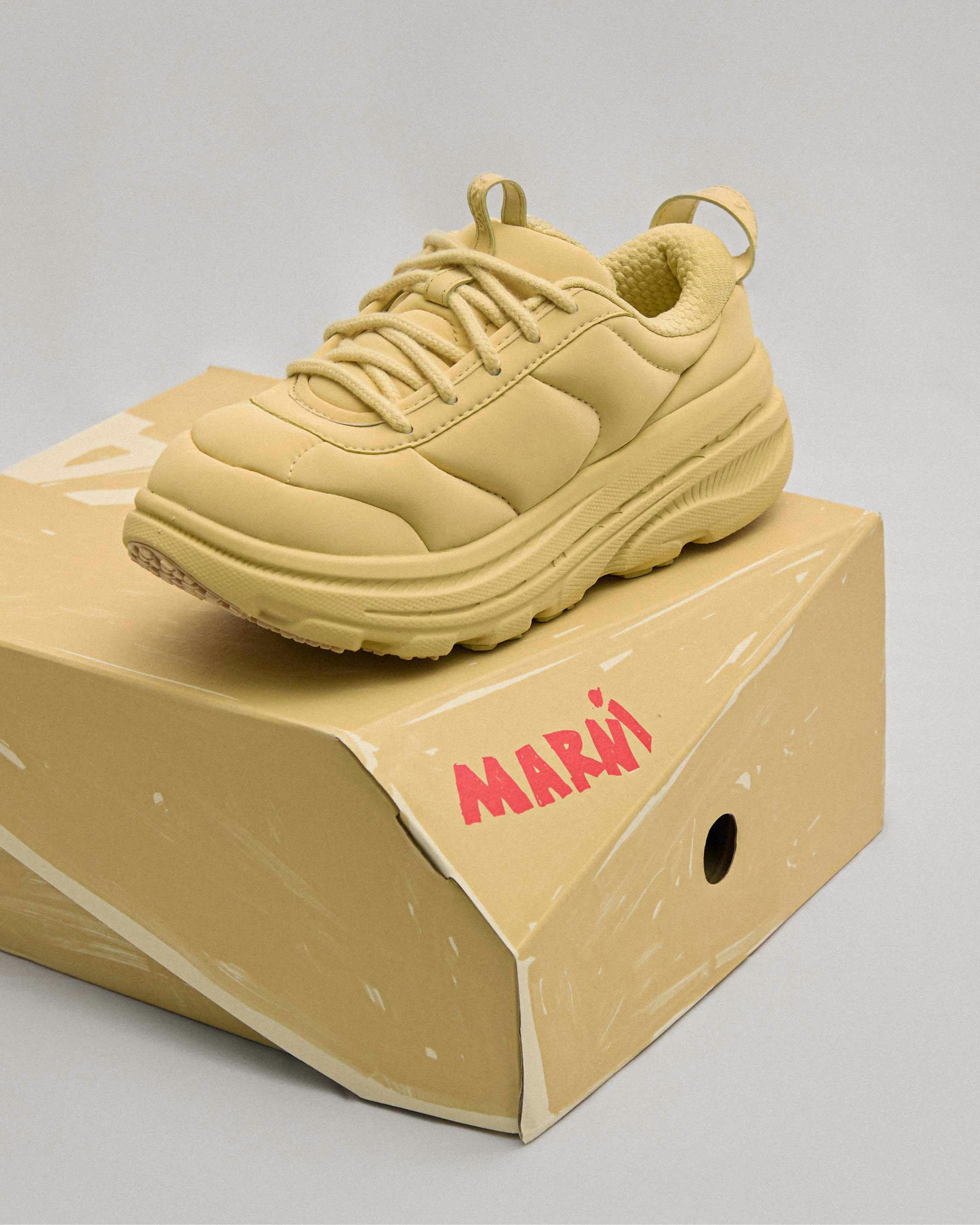 hoka marni sneaker in red, gold, black, blue colorways