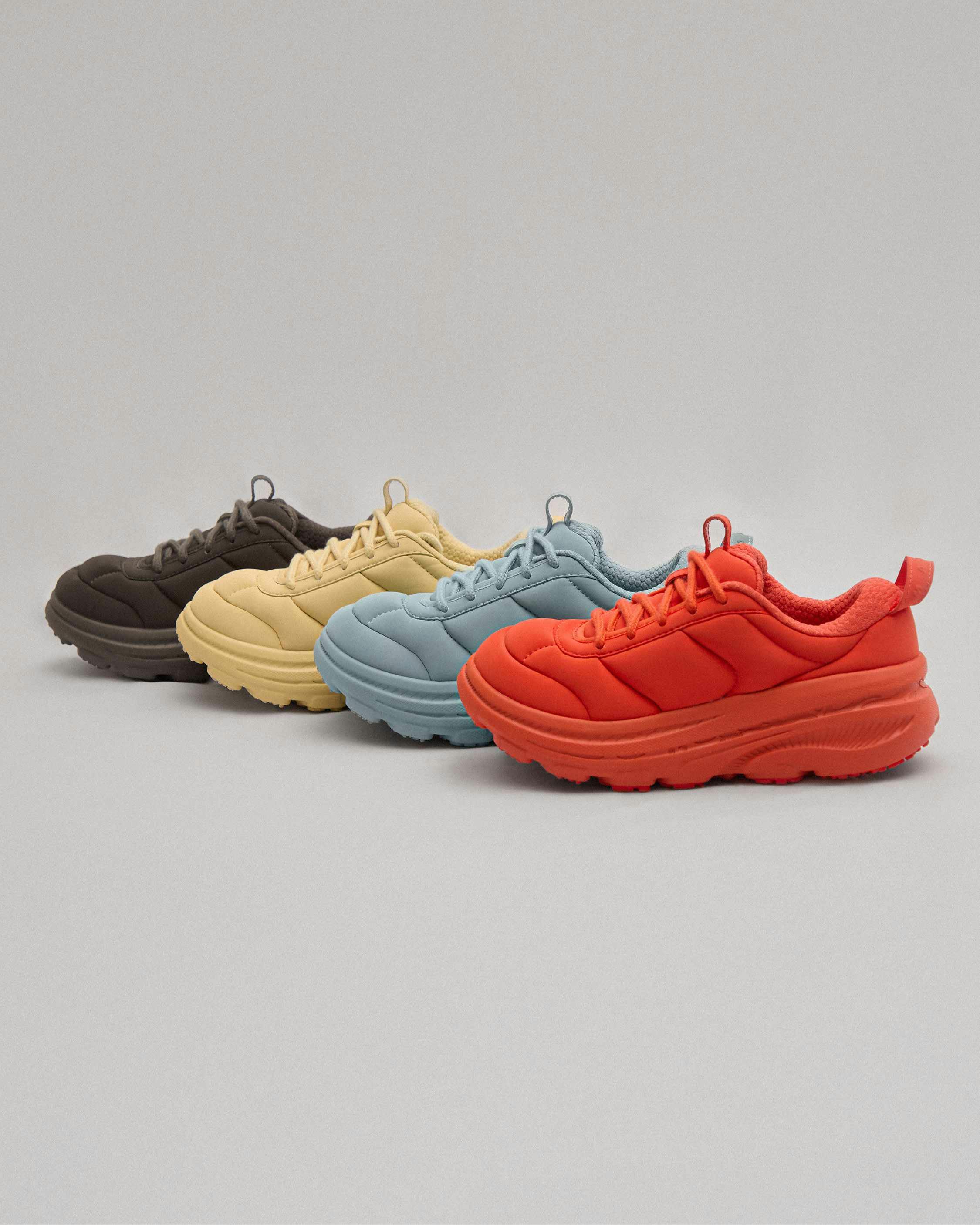 hoka marni sneaker in red, gold, black, blue colorways