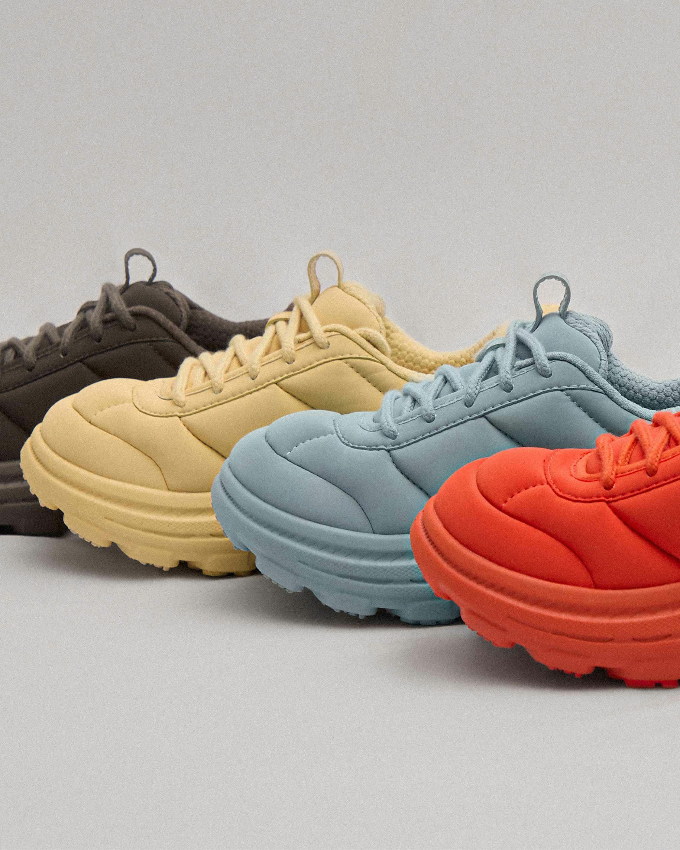 hoka marni sneaker in red, gold, black, blue colorways