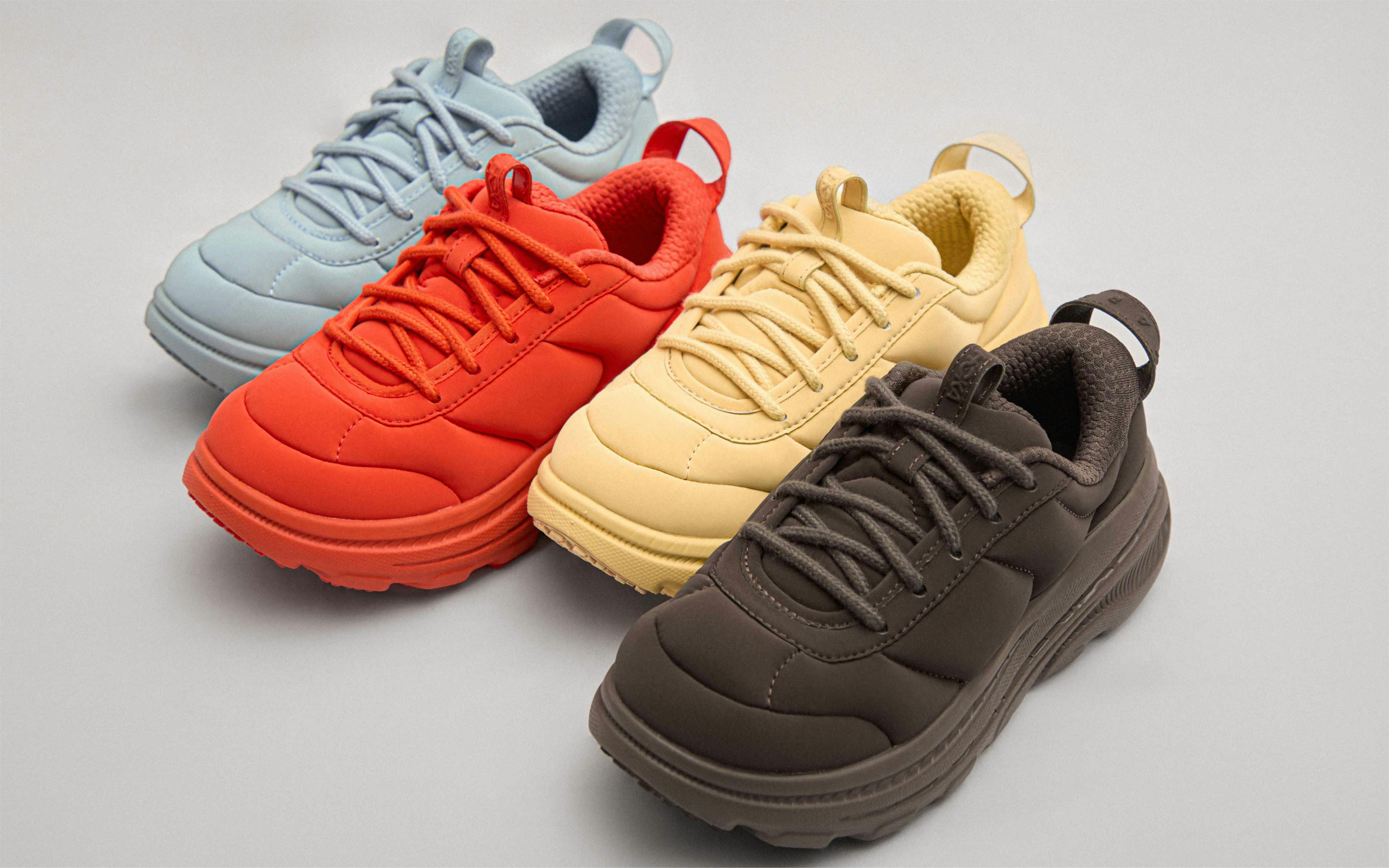 hoka marni sneaker in red, gold, black, blue colorways