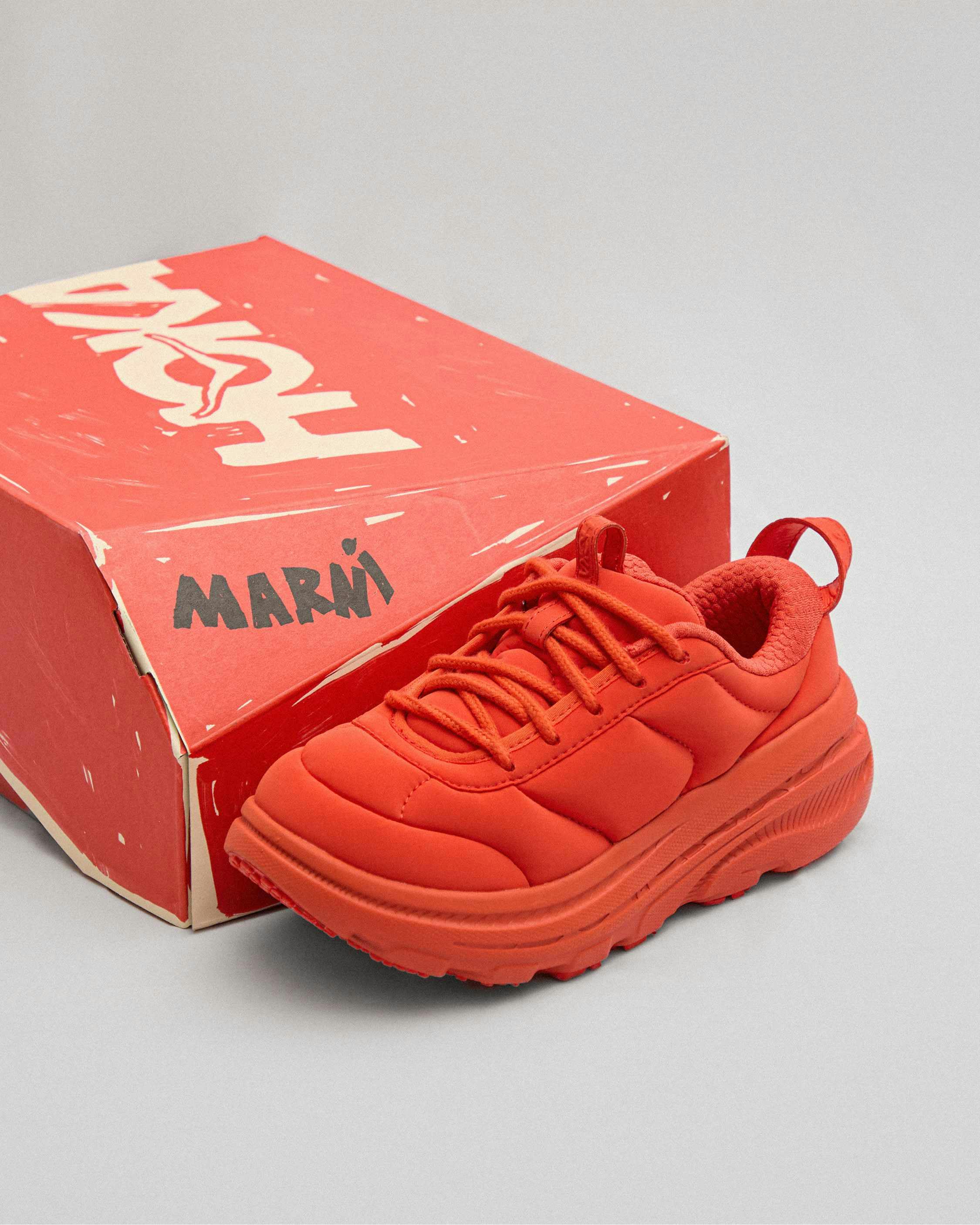 hoka marni sneaker in red, gold, black, blue colorways