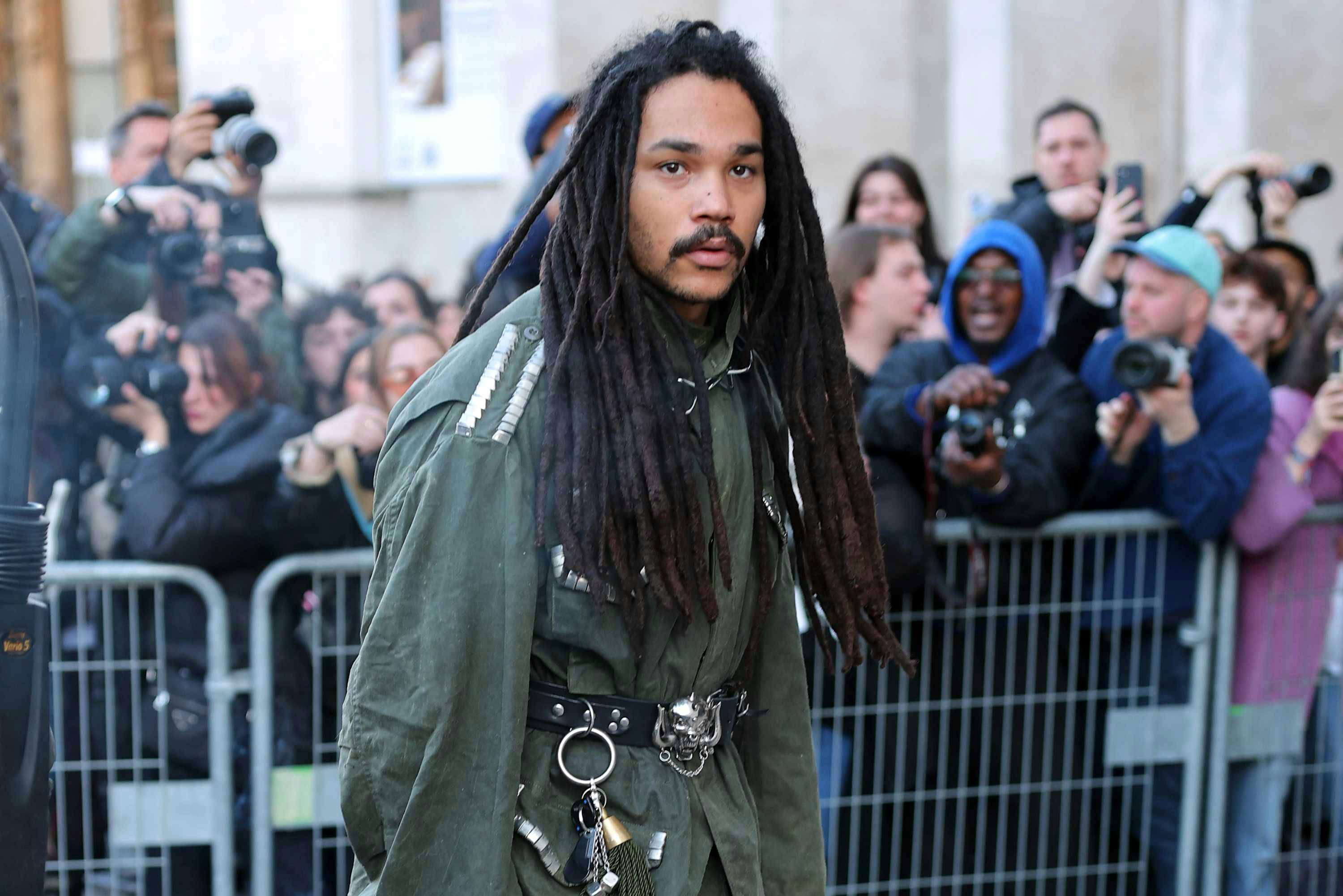 luka sabbat wearing a green top and beige pants at rick owens' fw25 fashion show in paris